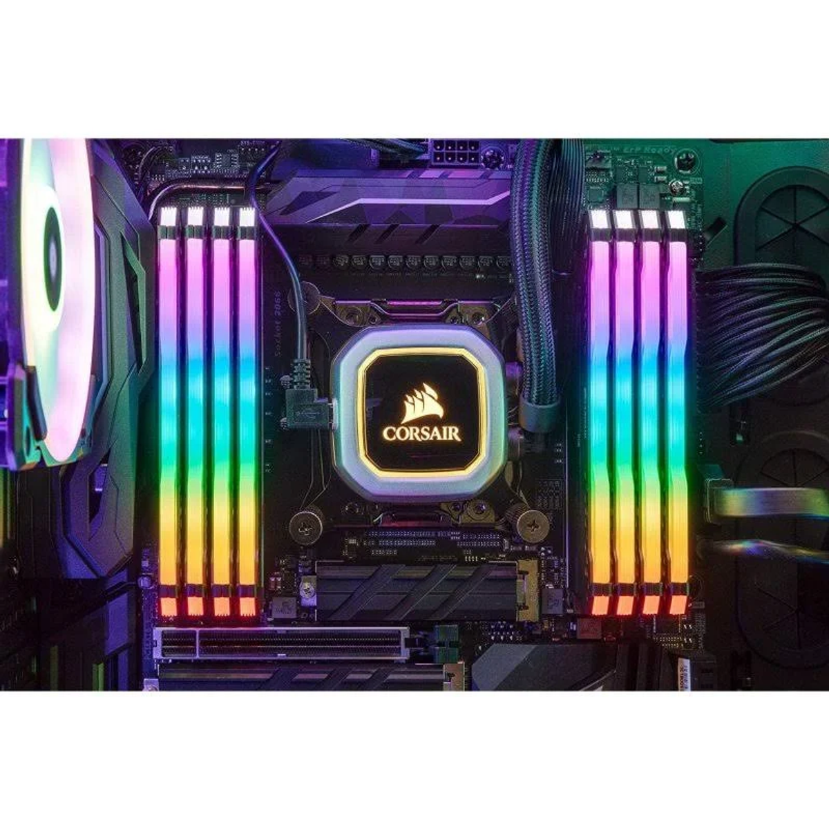 Componentes de ordenador: módulos de RAM con luces de colores, un enfriador de CPU con el logotipo de Corsair y placa base.
