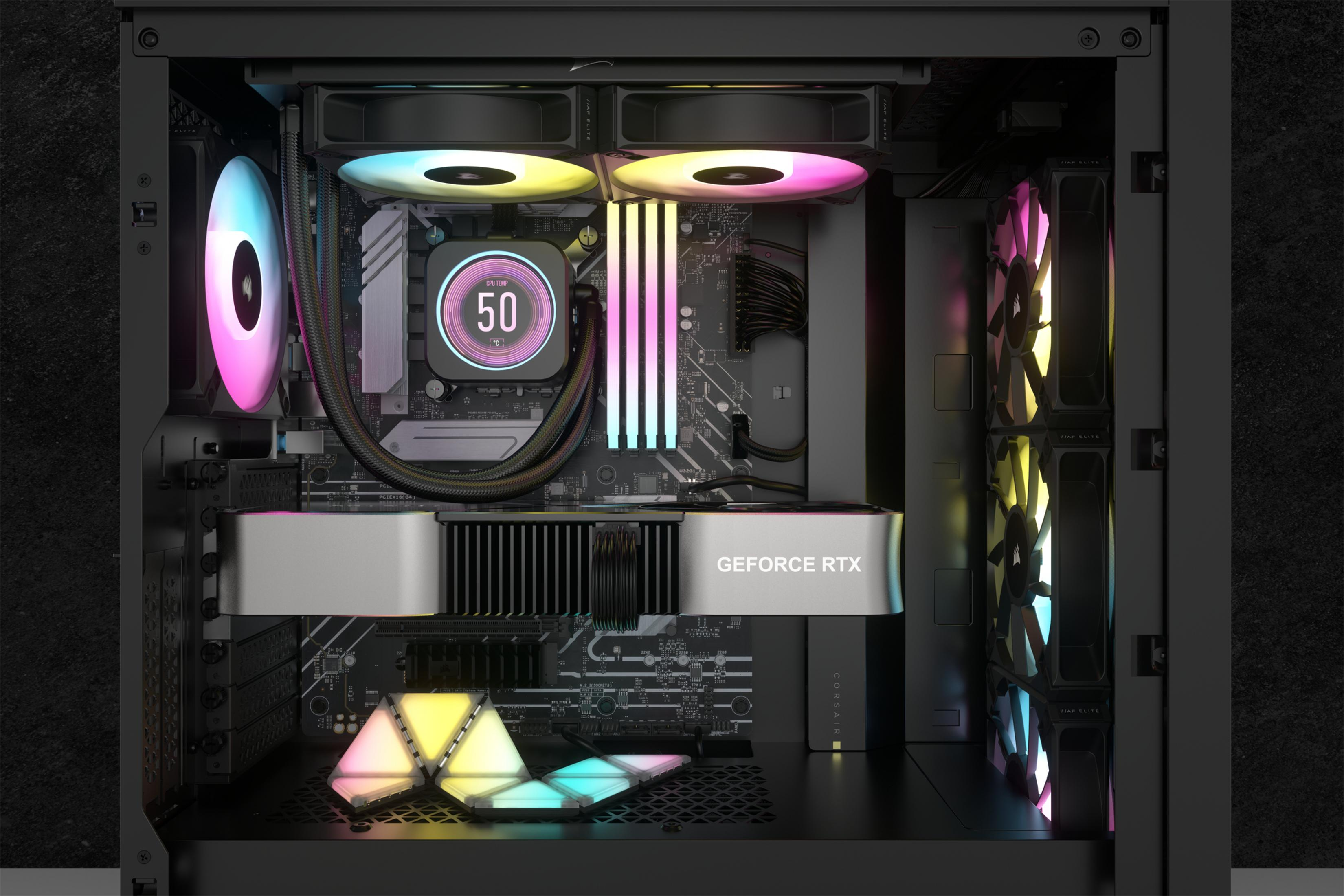 Dentro de una caja de computadora. Cuenta con una GPU, un enfriador de CPU y luces RGB.