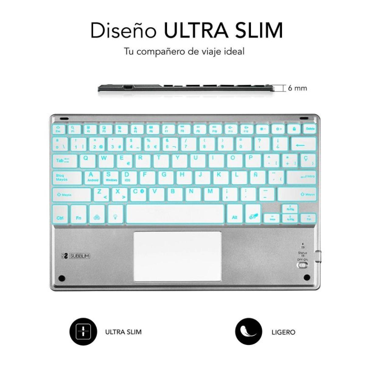 Un teclado plateado con panel táctil, con retroiluminación blanca. Tiene el nombre SUBBLIM.
