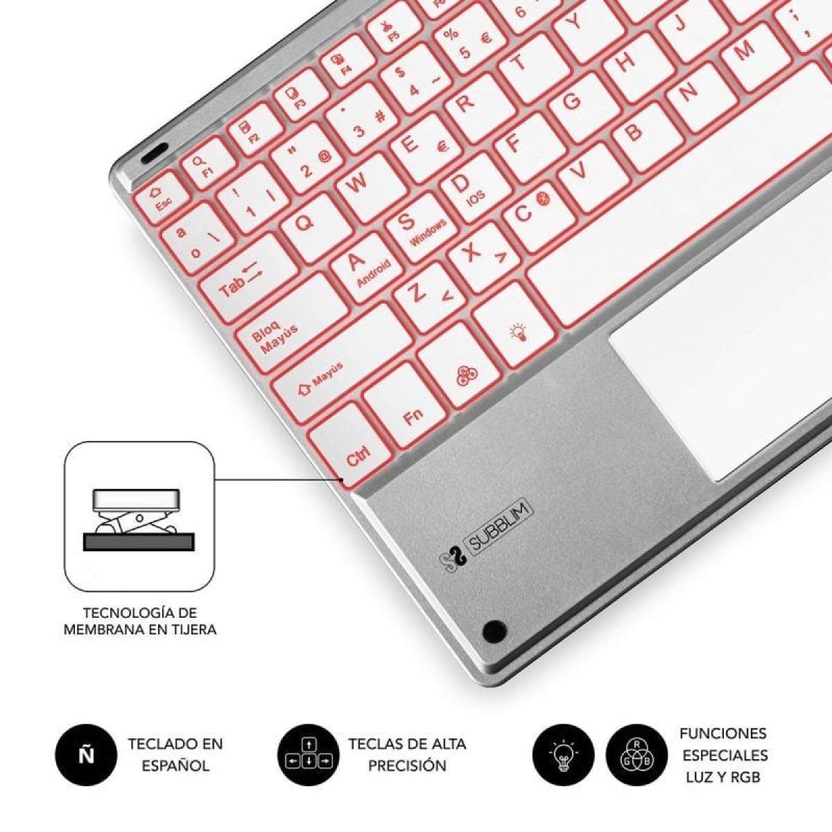 Un teclado plateado con teclas rojas y un panel táctil blanco. También hay iconos.