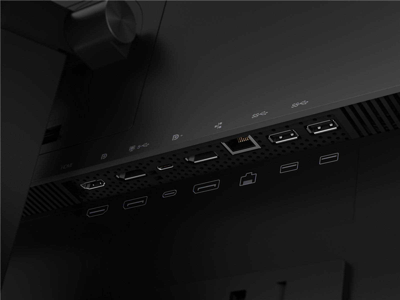 Nahaufnahme der Rückseite eines schwarzen Monitors mit verschiedenen Anschlüssen: HDMI, USB usw.