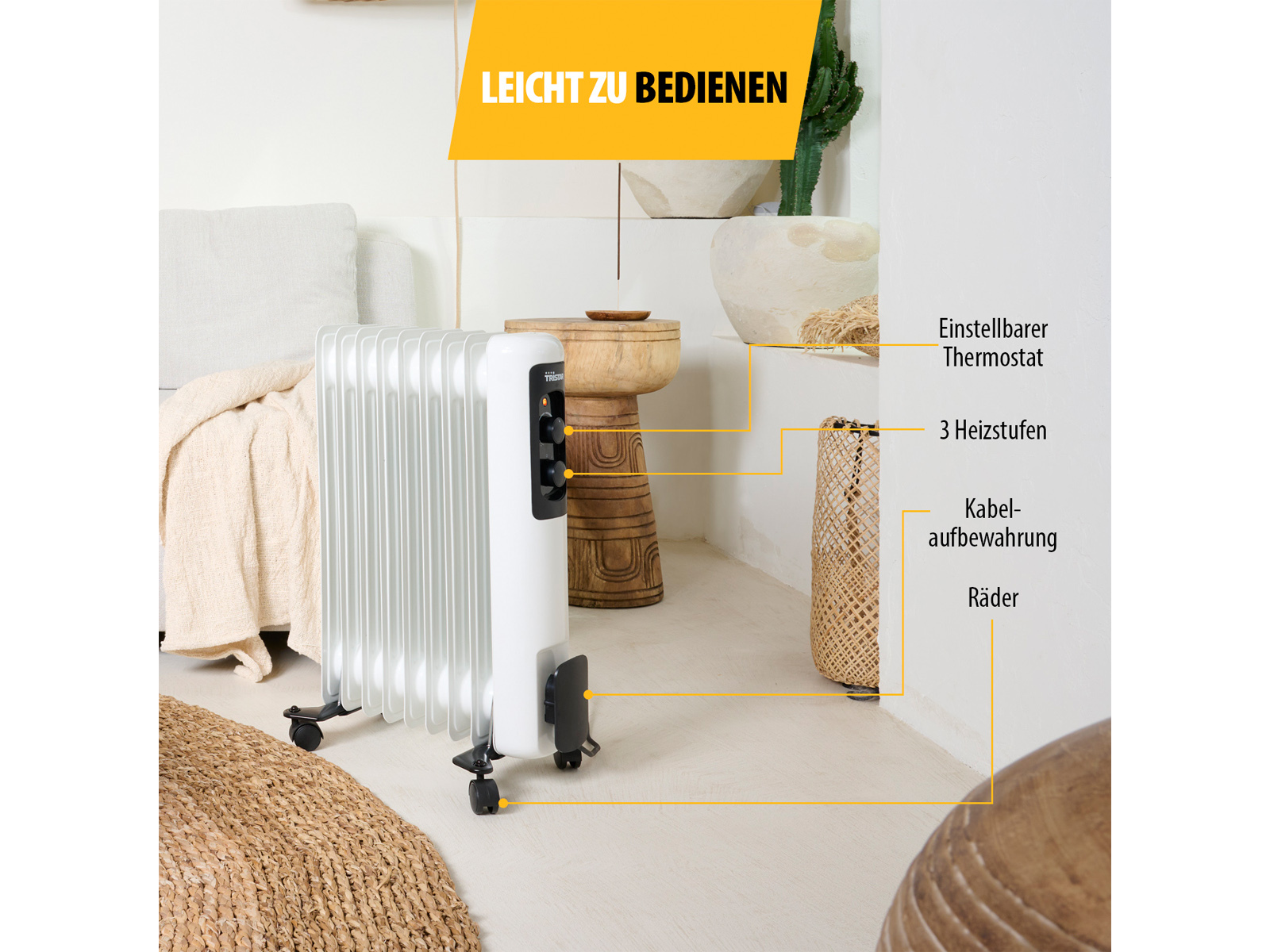 Termosifone ad olio bianco con pannello di controllo, in un ambiente soggiorno.