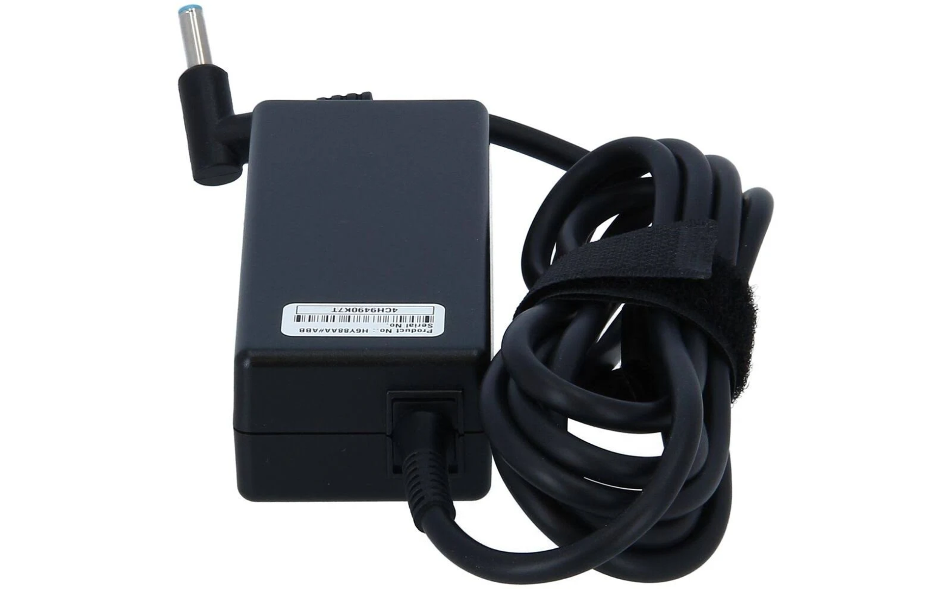 Black laptop power adapter with a cable wrapped by a velcro strap, white background.