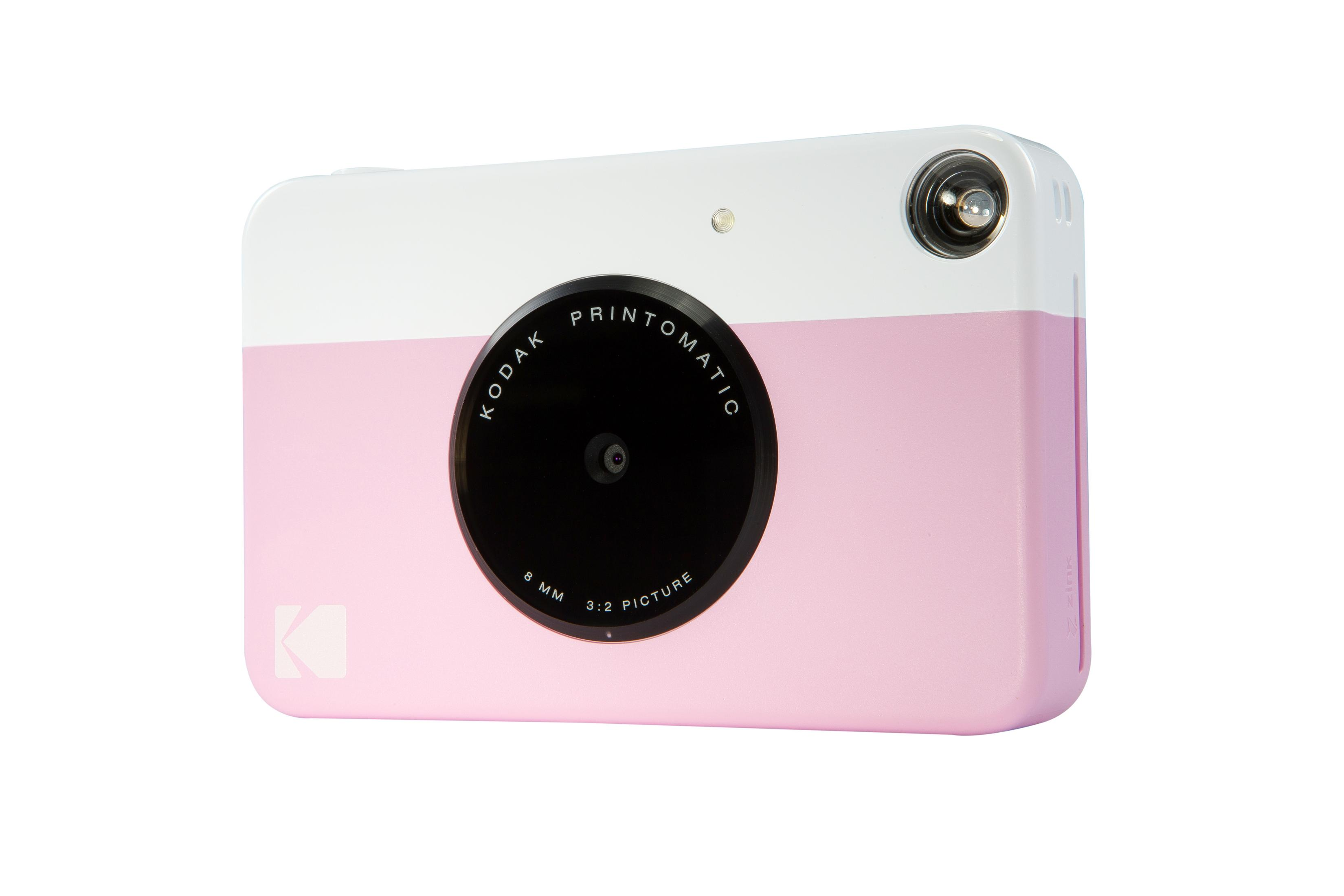 Fotocamera istantanea rosa e bianca. Sfondo bianco.