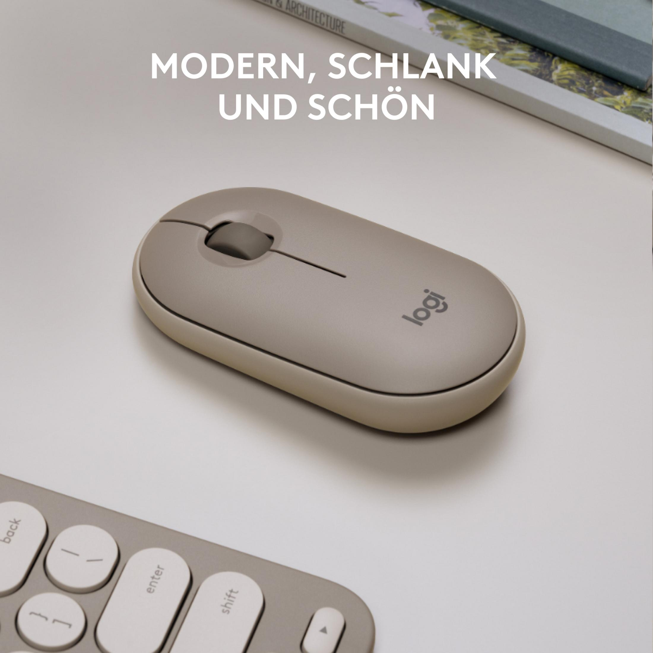 Een beige computermuis met het woord 'logi' erop, naast een toetsenbord en een boek. Tekst zegt 'Modern, Slank en Mooi'.