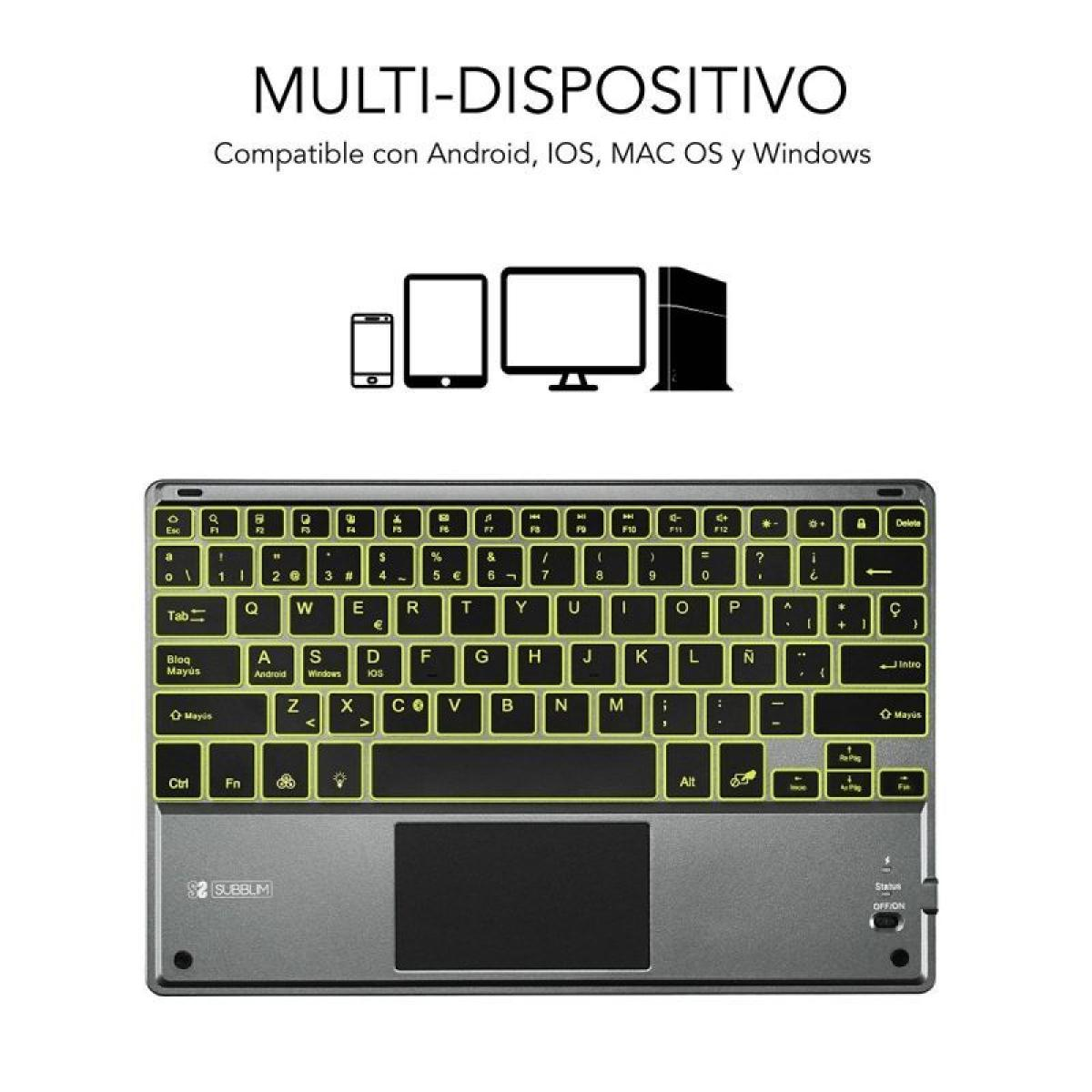 Un teclado gris con panel táctil y teclas iluminadas, compatible con múltiples dispositivos.