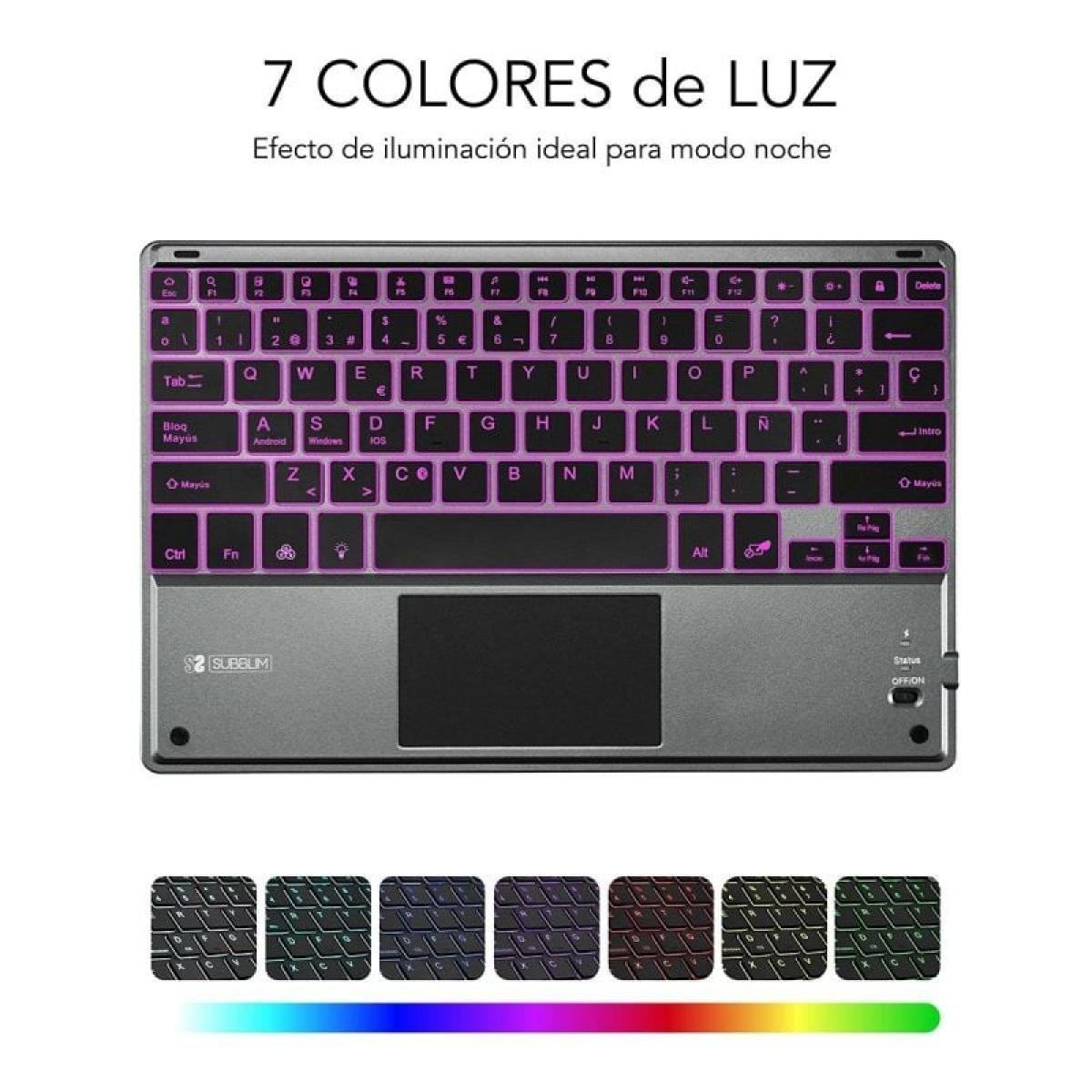 Teclado gris con luces coloridas y panel táctil, con patrones de luz adicionales debajo.