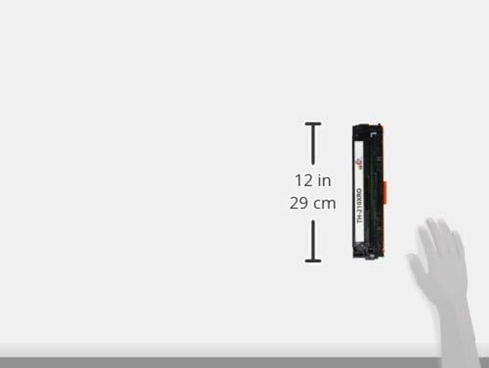 Tonerpatrone und ein Lineal, das ihre Länge zeigt: 12 Zoll und 29 cm.
