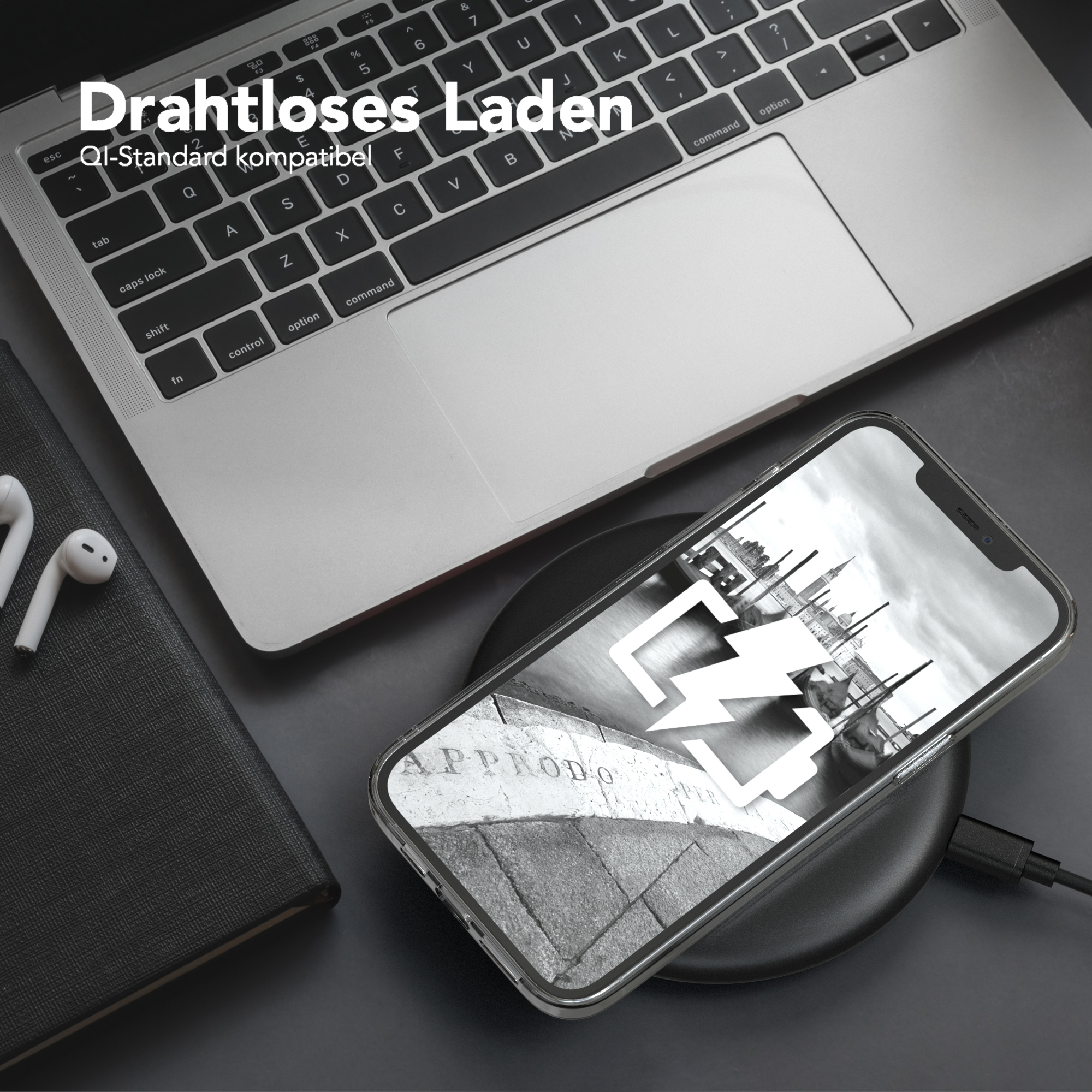 Laptop, Telefon auf Ladepad, mit Text: Drahtloses Laden.