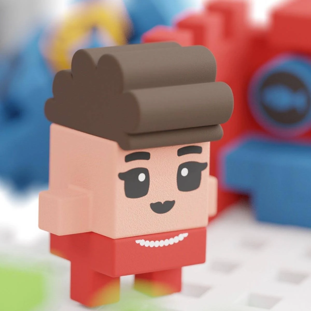 Spielzeug-Blockfigur eines Jungen mit braunen Haaren und rotem Hemd. Er hat einen Blockkörper und ein Gesicht.
