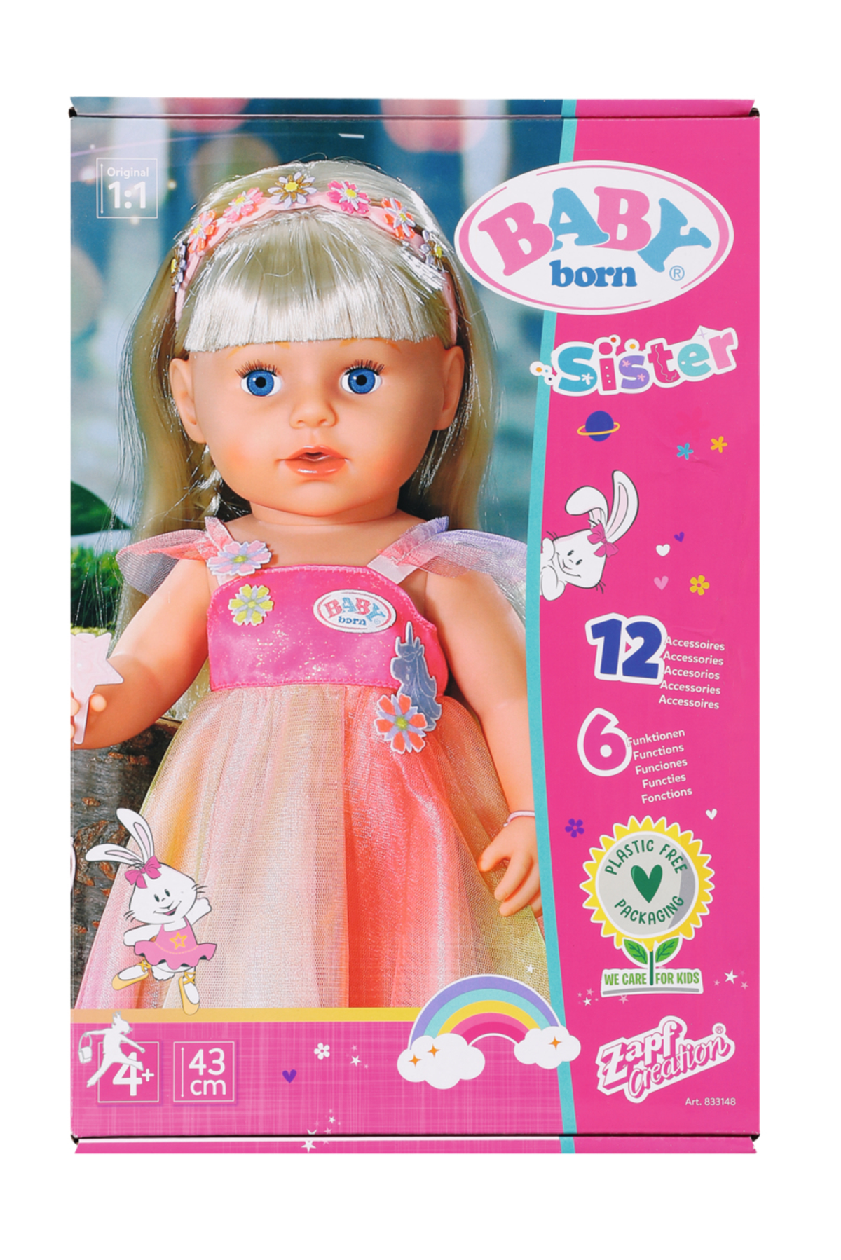 Baby Born Puppe in einer Box. Blondes Haar, blaue Augen, trägt ein rosa Kleid. Die Box hat Grafiken und Text.