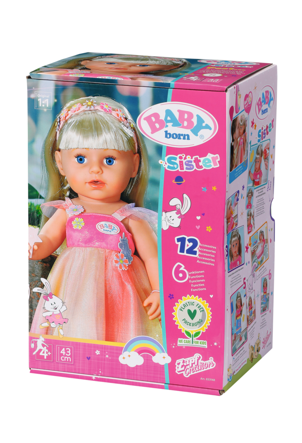 Eine Puppe in einer Schachtel mit blonden Haaren und einem rosa Kleid wird gezeigt.