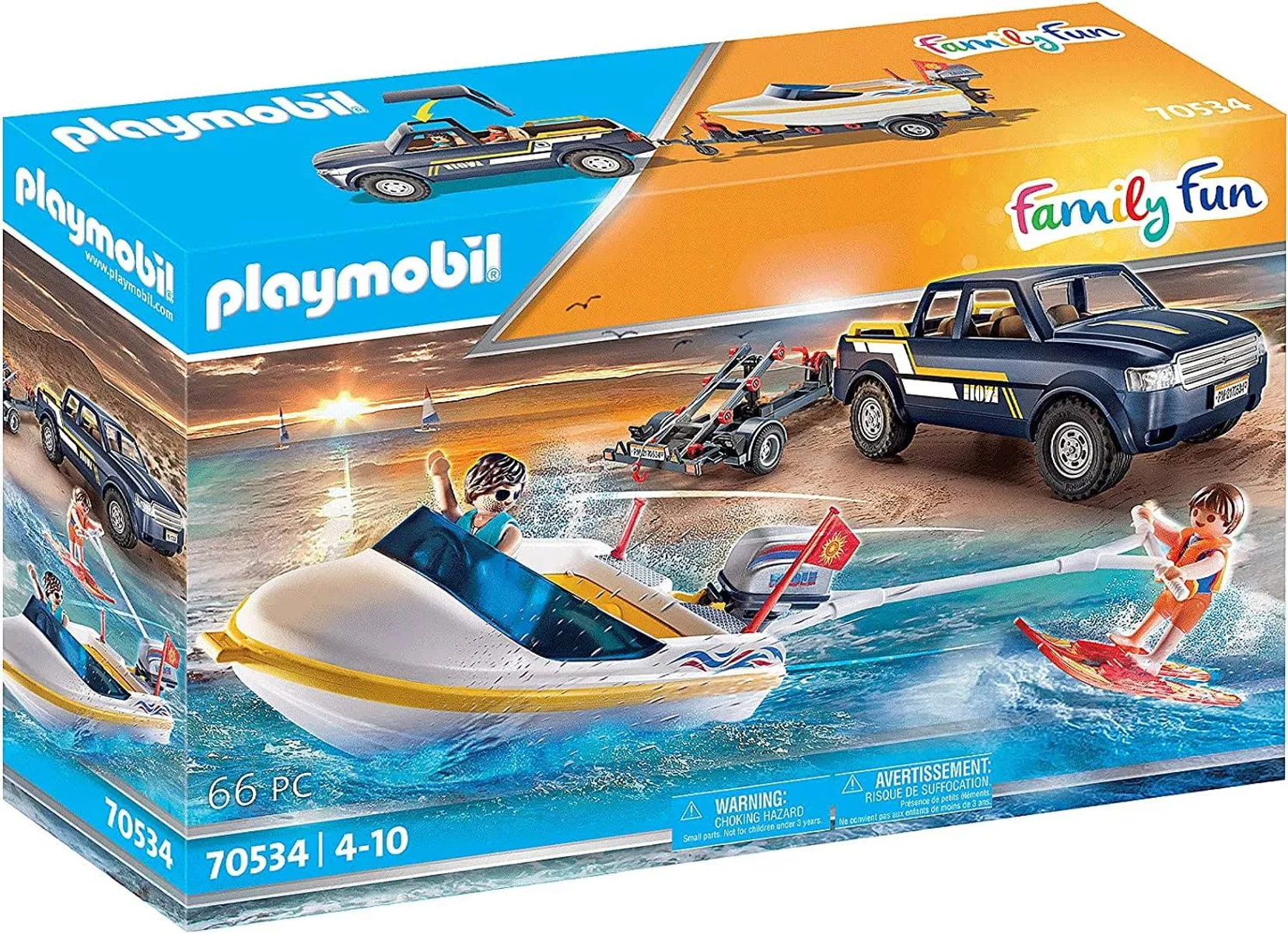 Pudełko z zestawem zabawek Playmobil: łódź, ciężarówka i dwie figurki Playmobil. Sceneria to plaża z wodą.