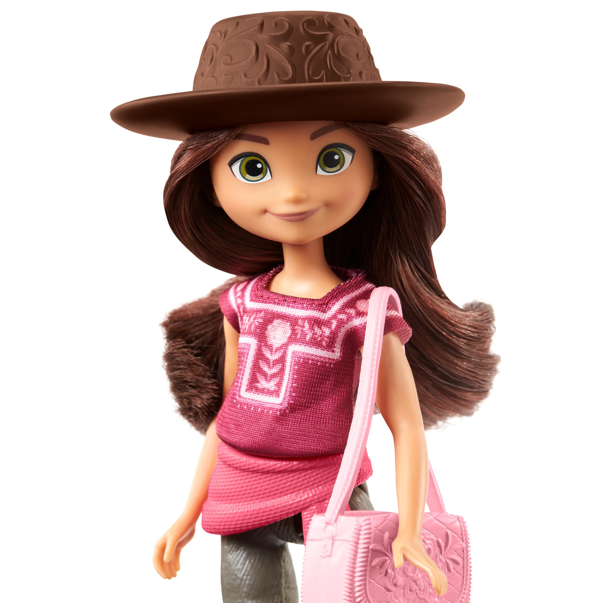 Lalka dziewczynki w brązowym kapeluszu i różowym stroju, z różową torbą. Uśmiecha się.