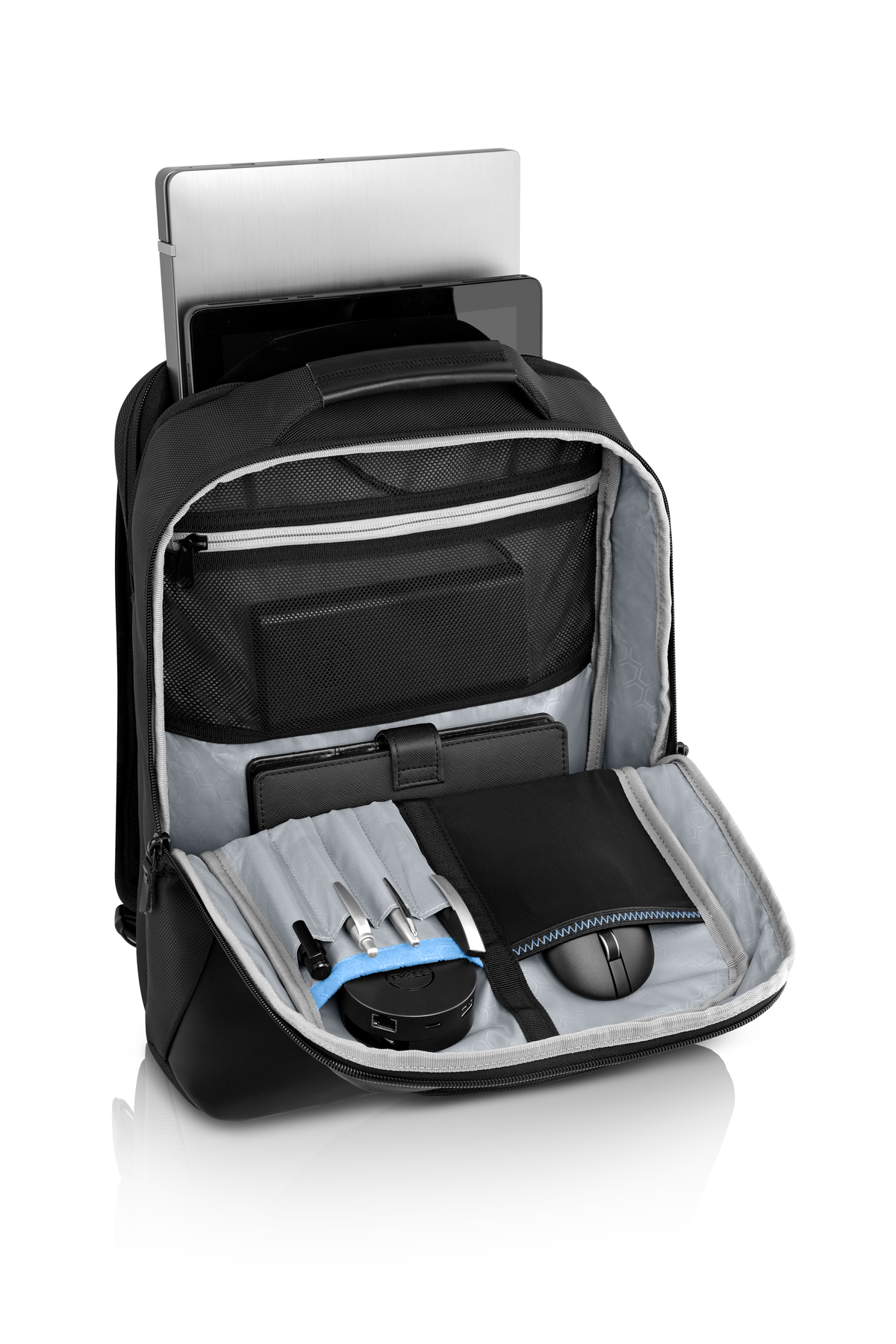 Zaino nero, aperto con laptop, tablet, accessori. Argento e nero.