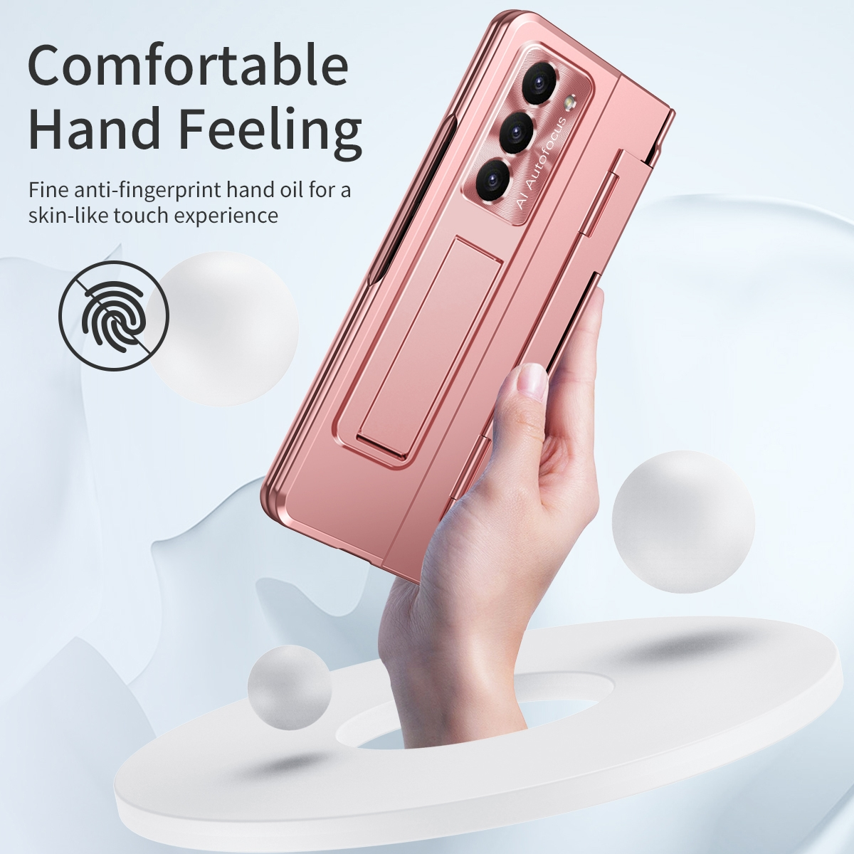 Ein pinkfarbenes, faltbares Telefon wird von einer Person gehalten. Weiße Kugeln sind drumherum.