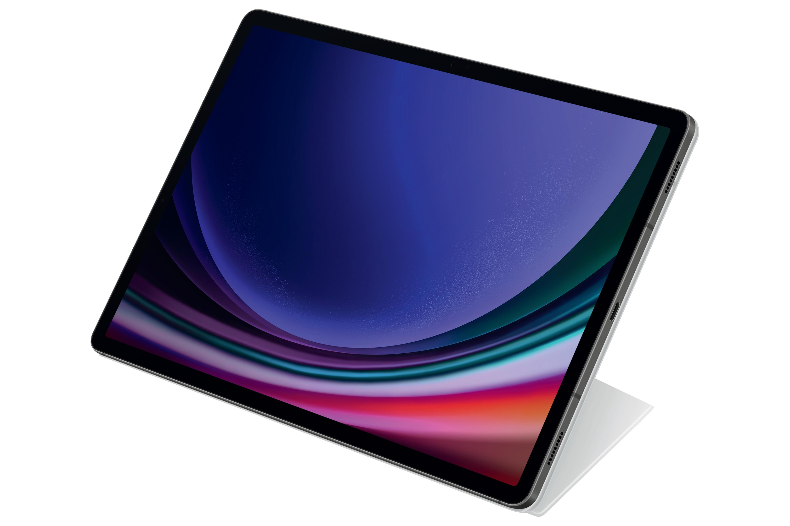 Tablet pod kątem z ciemnoniebieskim ekranem. Ekran ma kolorowe tło.