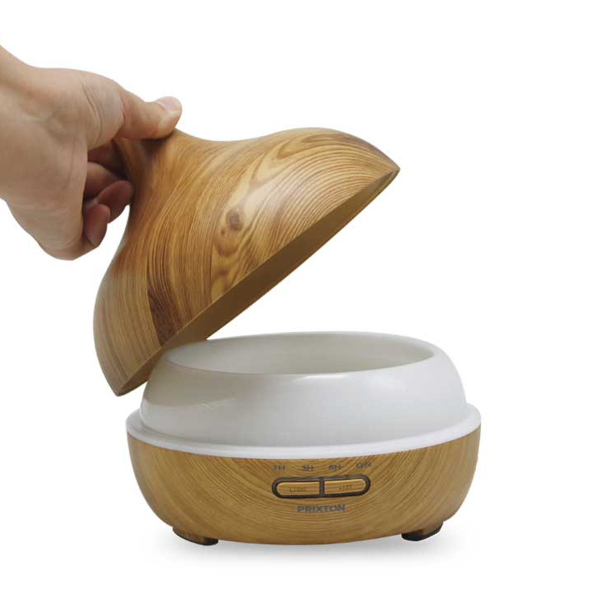 Ręka otwierająca dyfuzor do aromaterapii w stylu drewnianym, odsłaniając białe wnętrze.