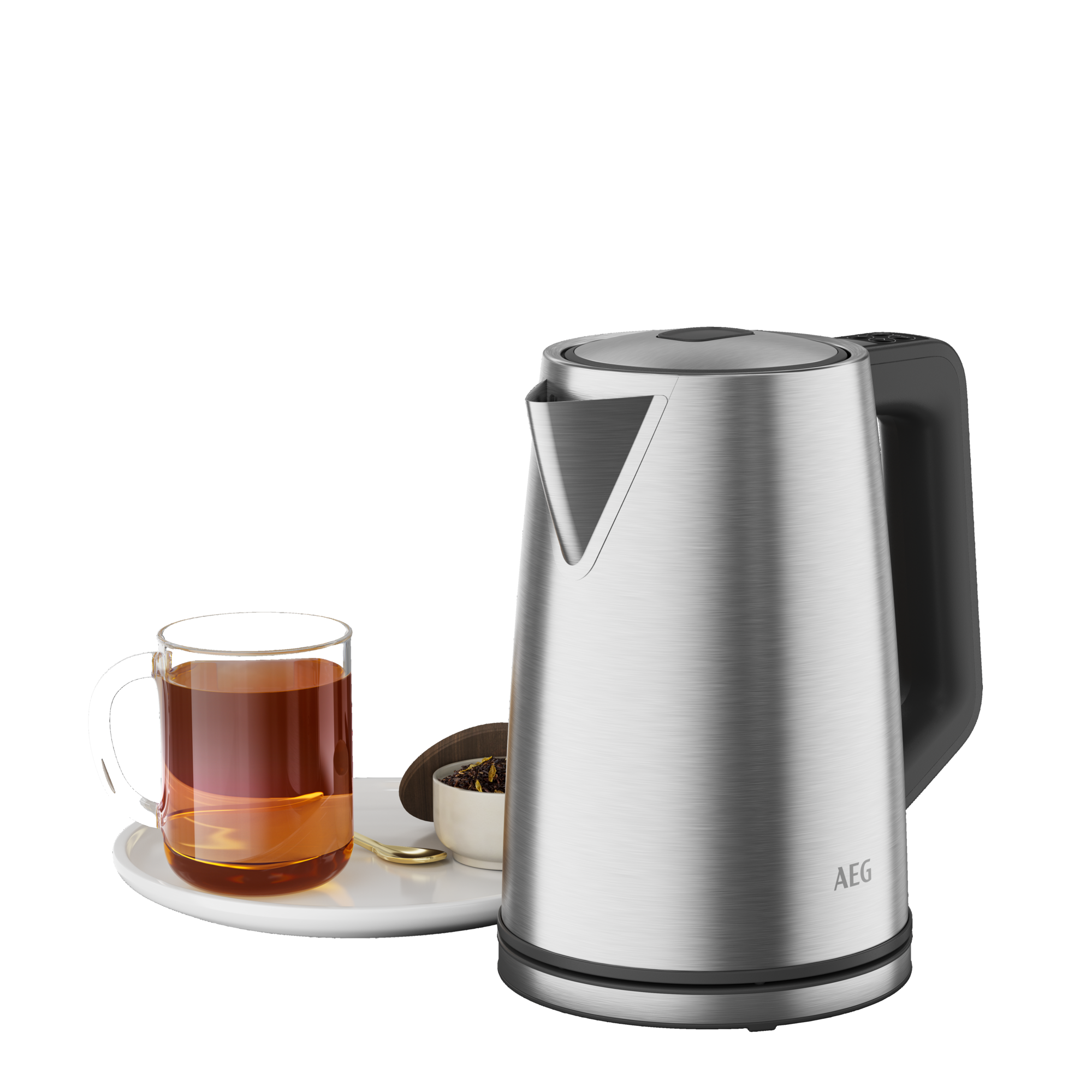 Ein Edelstahl-Wasserkocher mit einer Tasse Tee, einer kleinen Schale mit Teeblättern und einem Löffel.