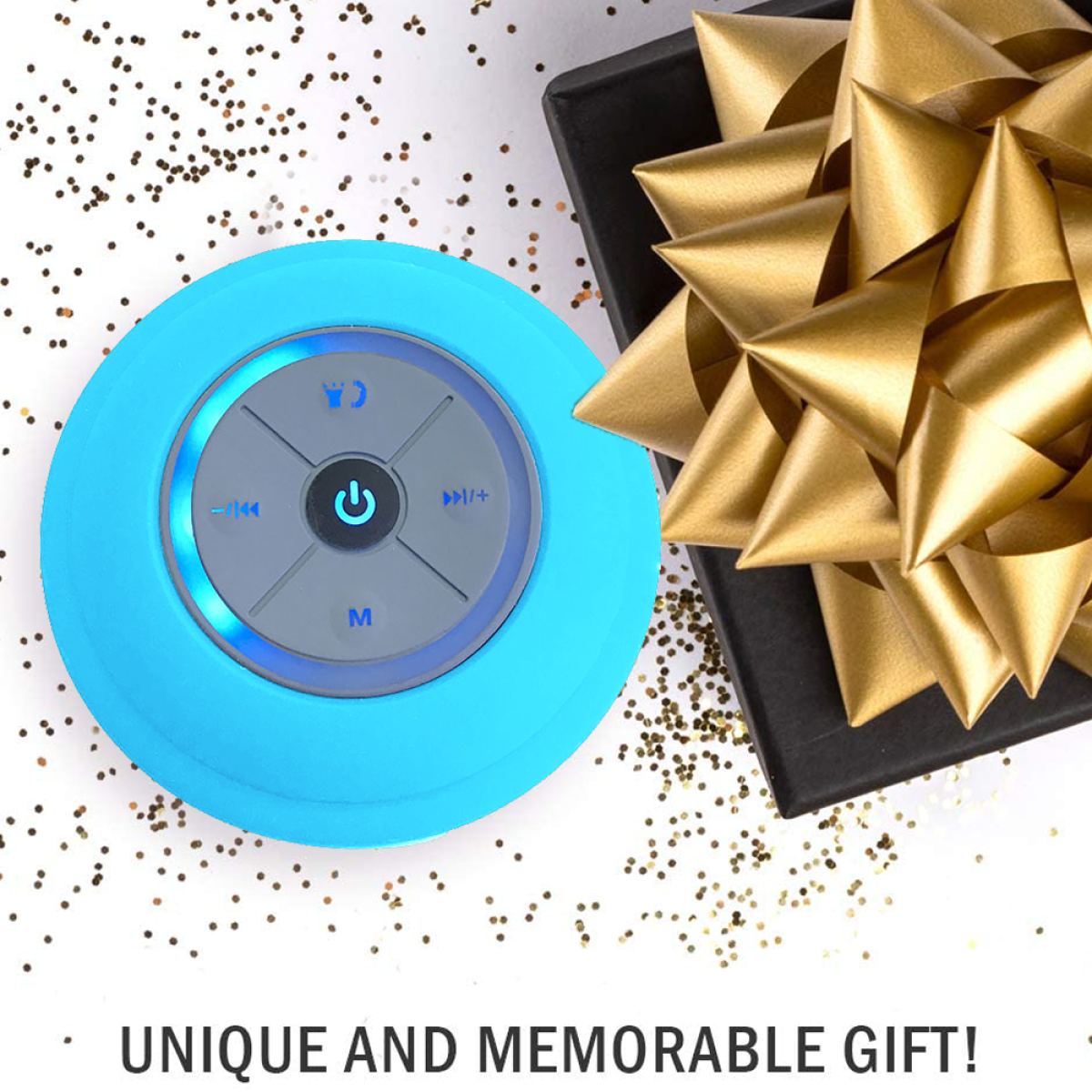 Blauer wasserdichter Lautsprecher mit Bedienelementen, schwarze Geschenkbox mit goldener Schleife und Goldkonfetti.