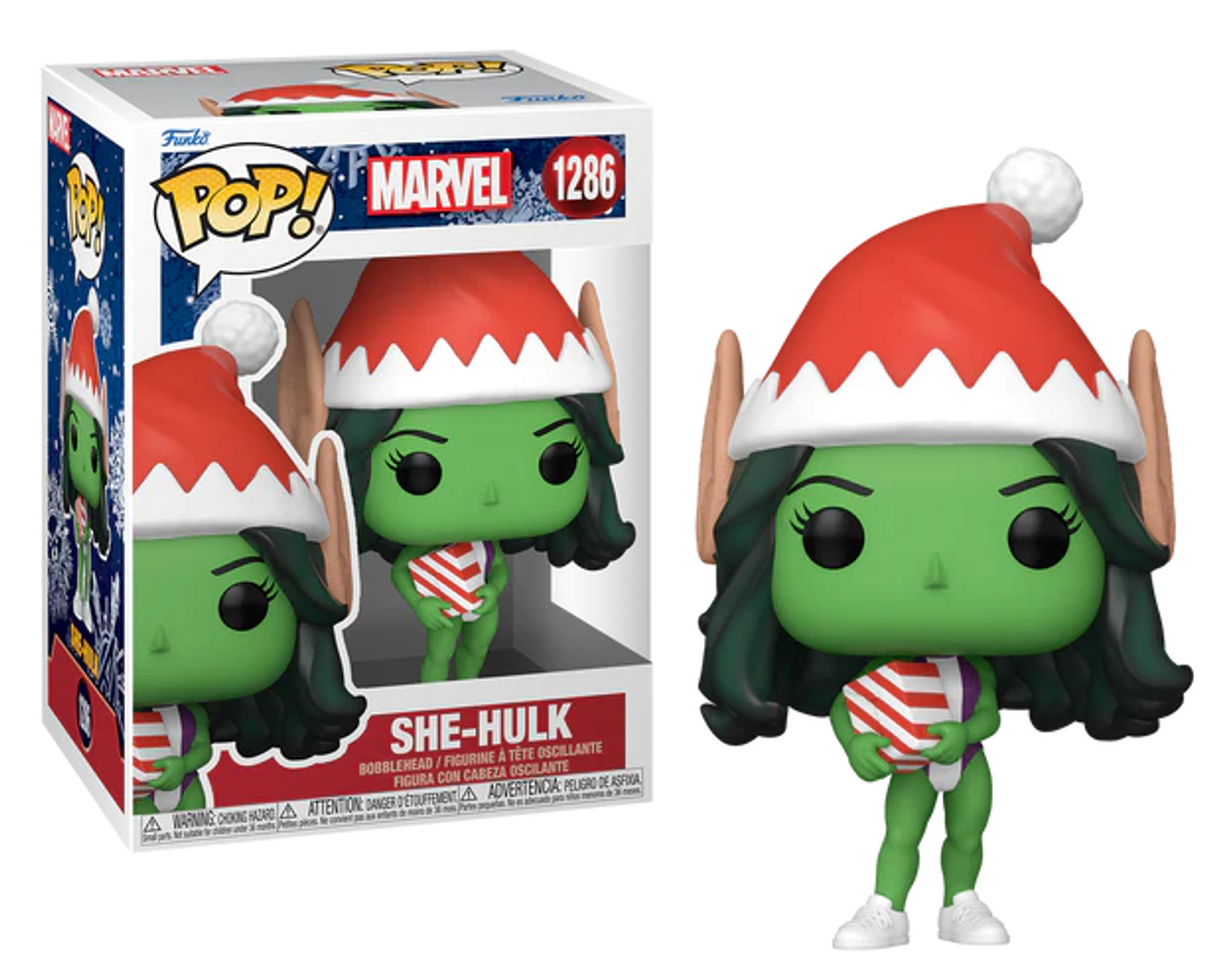 Figura de She-Hulk con gorro de Papá Noel. Caja con She-Hulk visible a la izquierda.