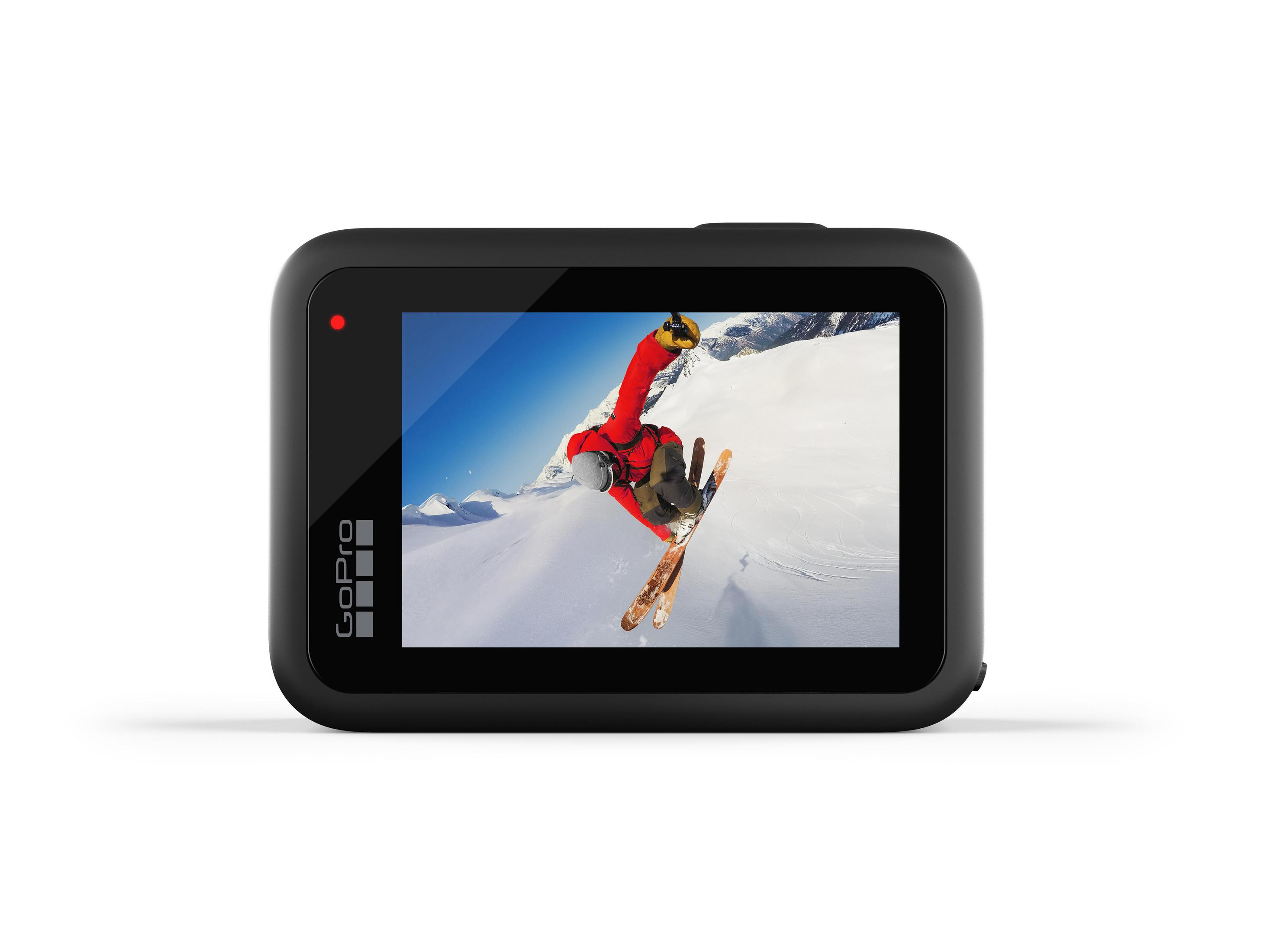 Une caméra GoPro noire est montrée, affichant un skieur en l'air sur une scène de montagne enneigée. Le logo GoPro est visible.