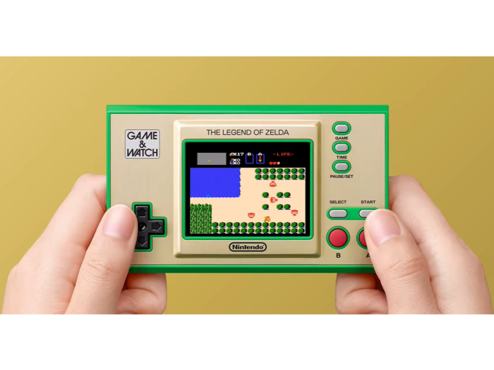 Mani che tengono un Game & Watch. Lo schermo mostra il gioco The Legend of Zelda.