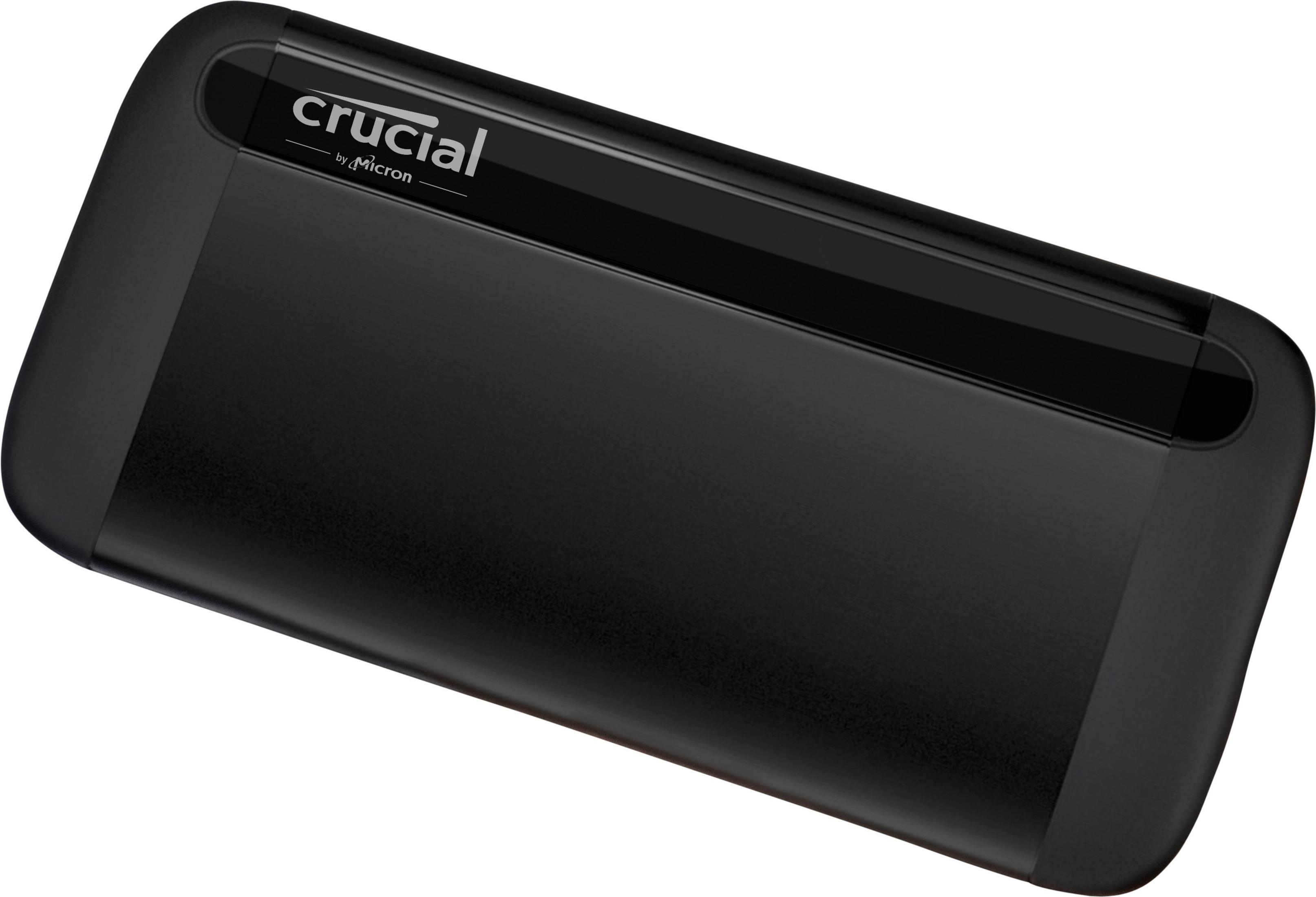 Schwarze externe Crucial SSD. Rechteckig, mit abgerundeten Kanten, Markenname oben.