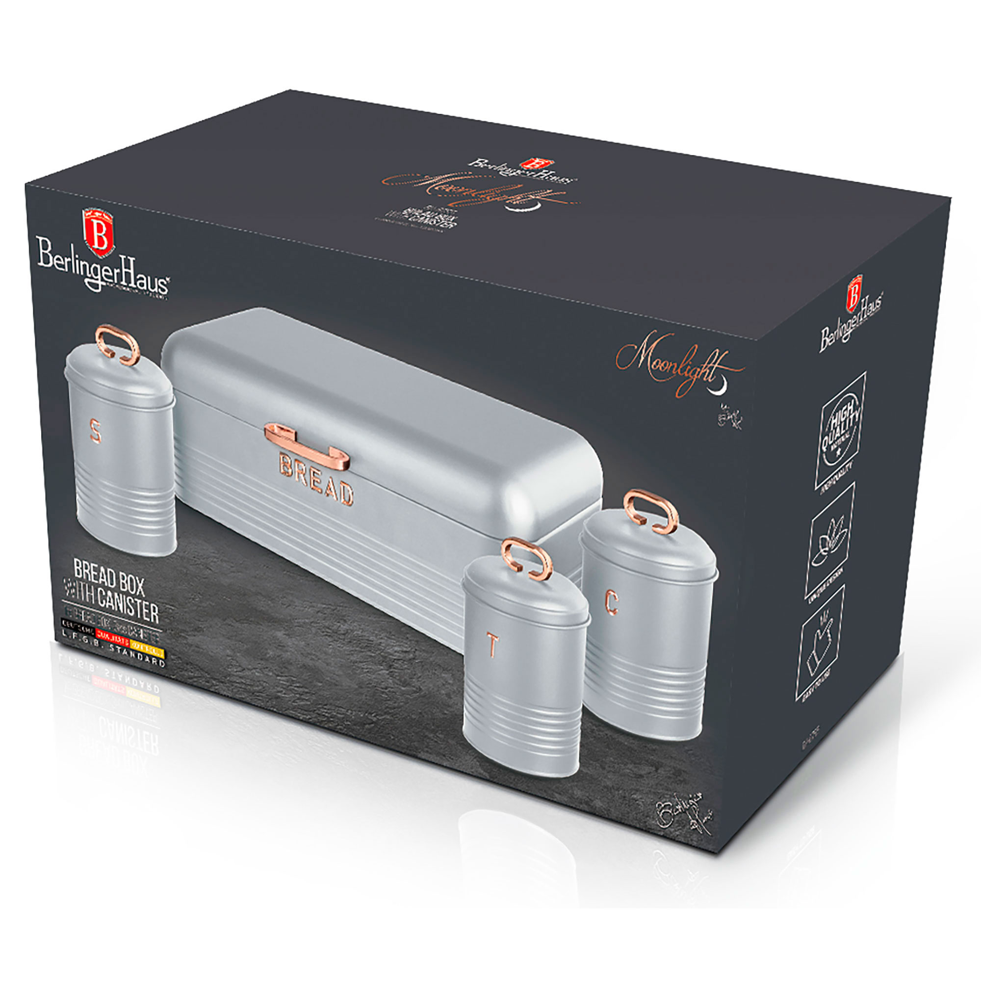 Silberne Brotbox mit zwei Kanistern auf einer schwarzen Schachtel. Roségold-Akzente.