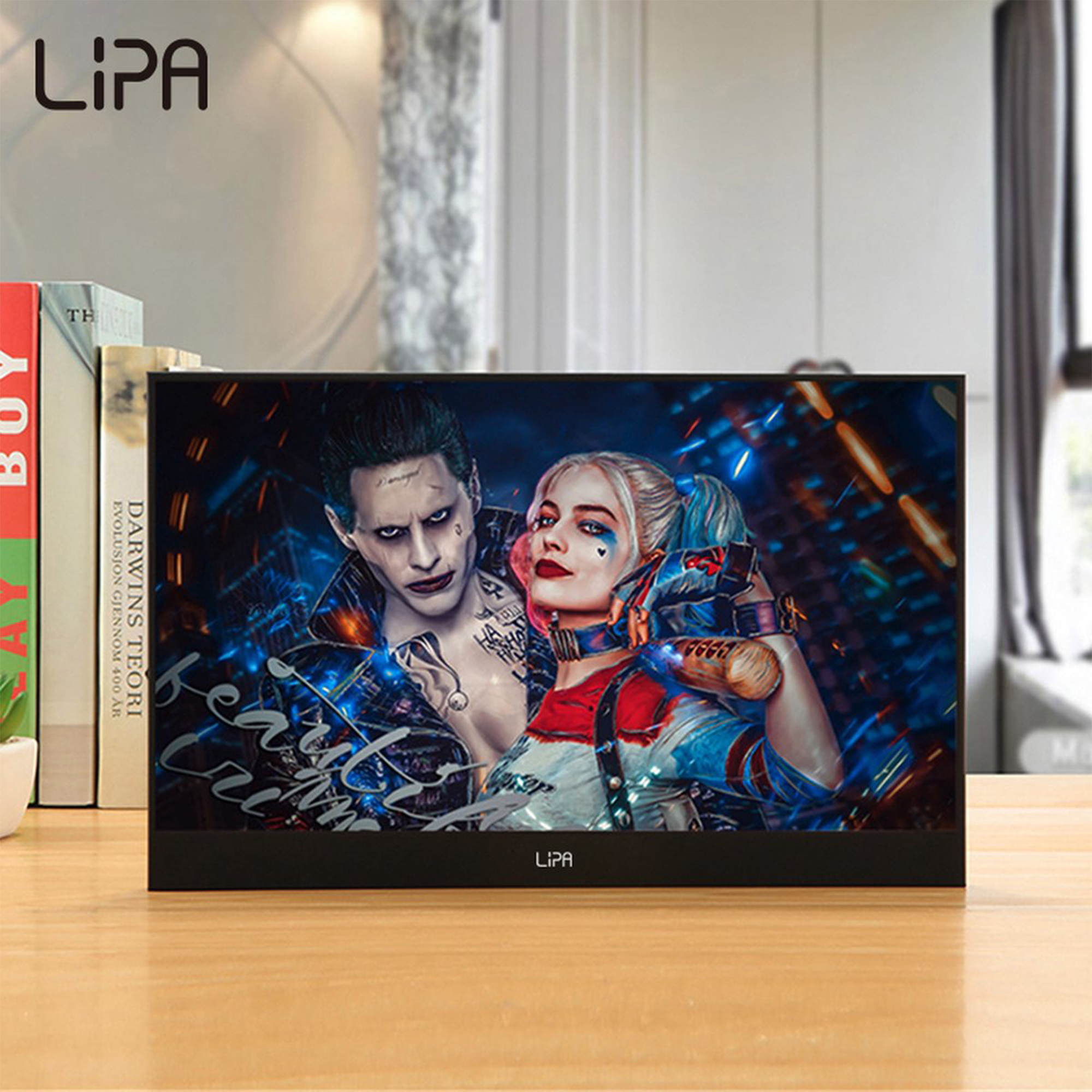Czarny monitor wyświetlający obraz Harley Quinn i Jokera. Marka to 'LIPA'.