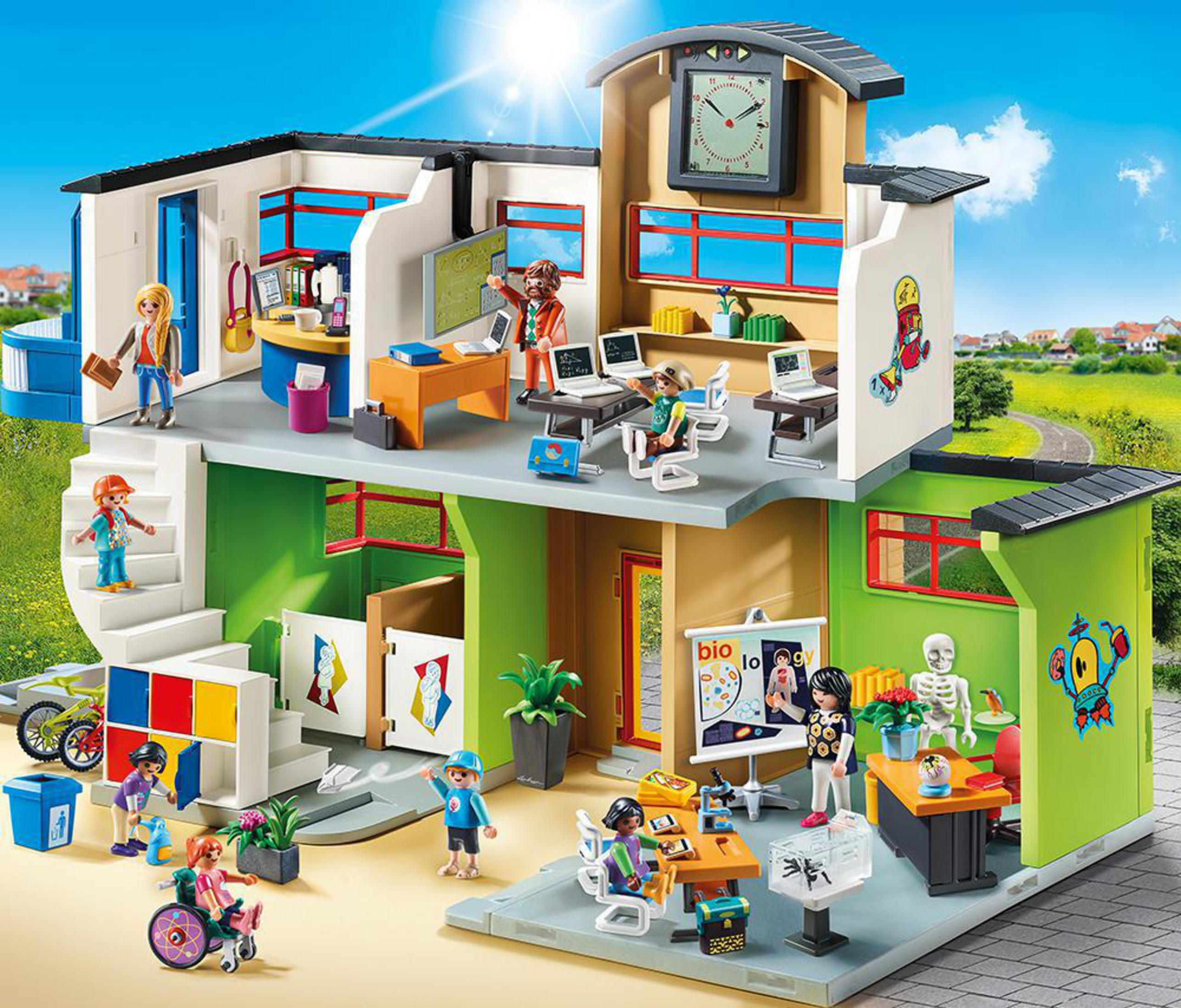 Set di gioco scolastico Playmobil con studenti e insegnanti in un ambiente colorato e dettagliato.