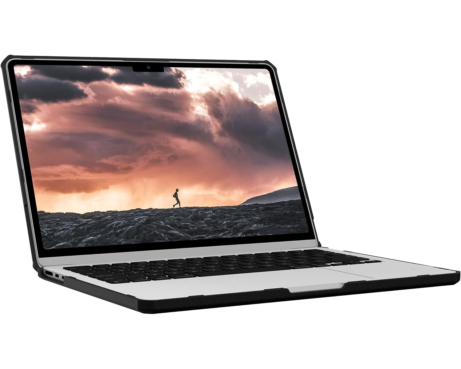 Laptop con schermo che mostra una persona che cammina su una superficie nera sotto un cielo nuvoloso.
