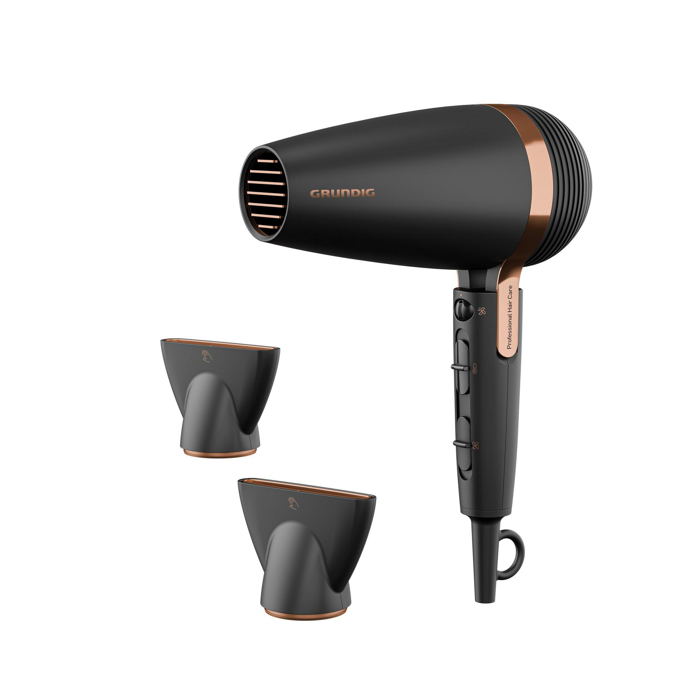 Czarna suszarka do włosów Grundig ze złotymi akcentami, dwiema dyszami i pętlą do wieszania.