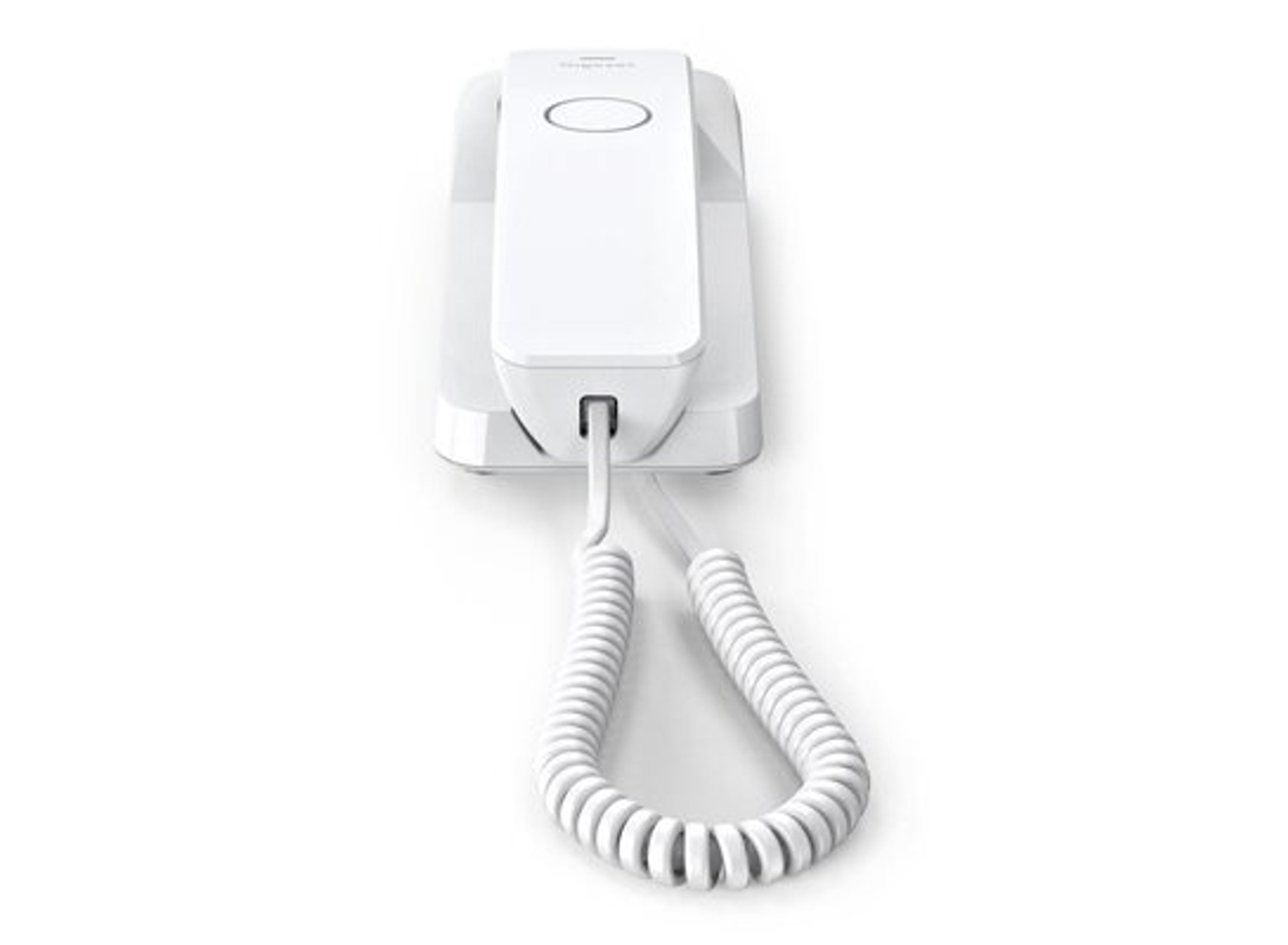 Un telefono a muro bianco con un cavo a spirale sulla superficie bianca.