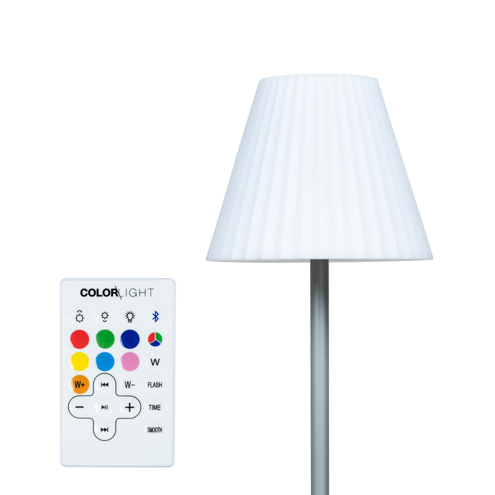 Une lampe blanche avec abat-jour plissé à côté d'une télécommande avec des boutons.