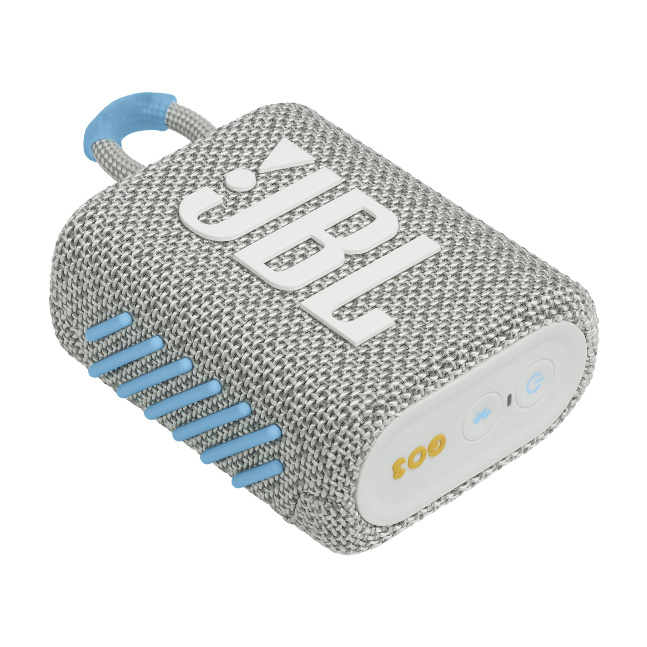 Mały głośnik JBL. Jest szary z niebieskimi akcentami i białym logo JBL.