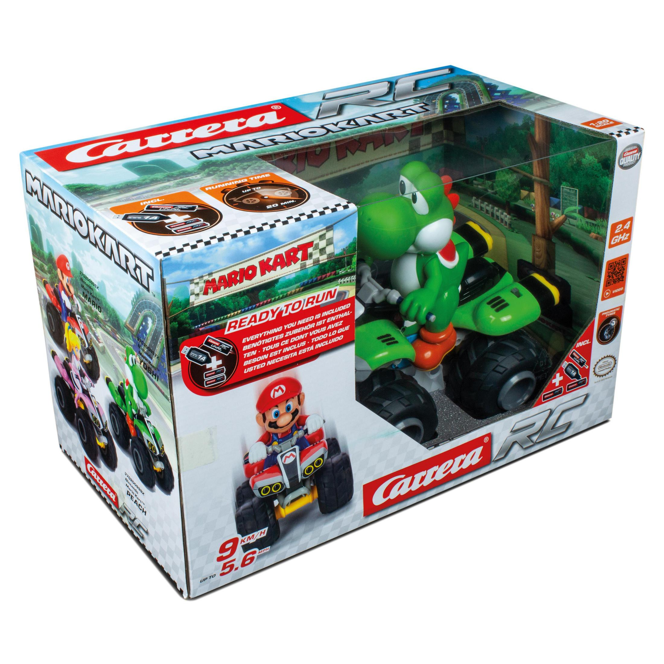 Mario Kart Spielzeug in einer Box, mit einer grünen Yoshi-Figur auf einem Kart. Die Box zeigt Mario auf einem anderen Kart.
