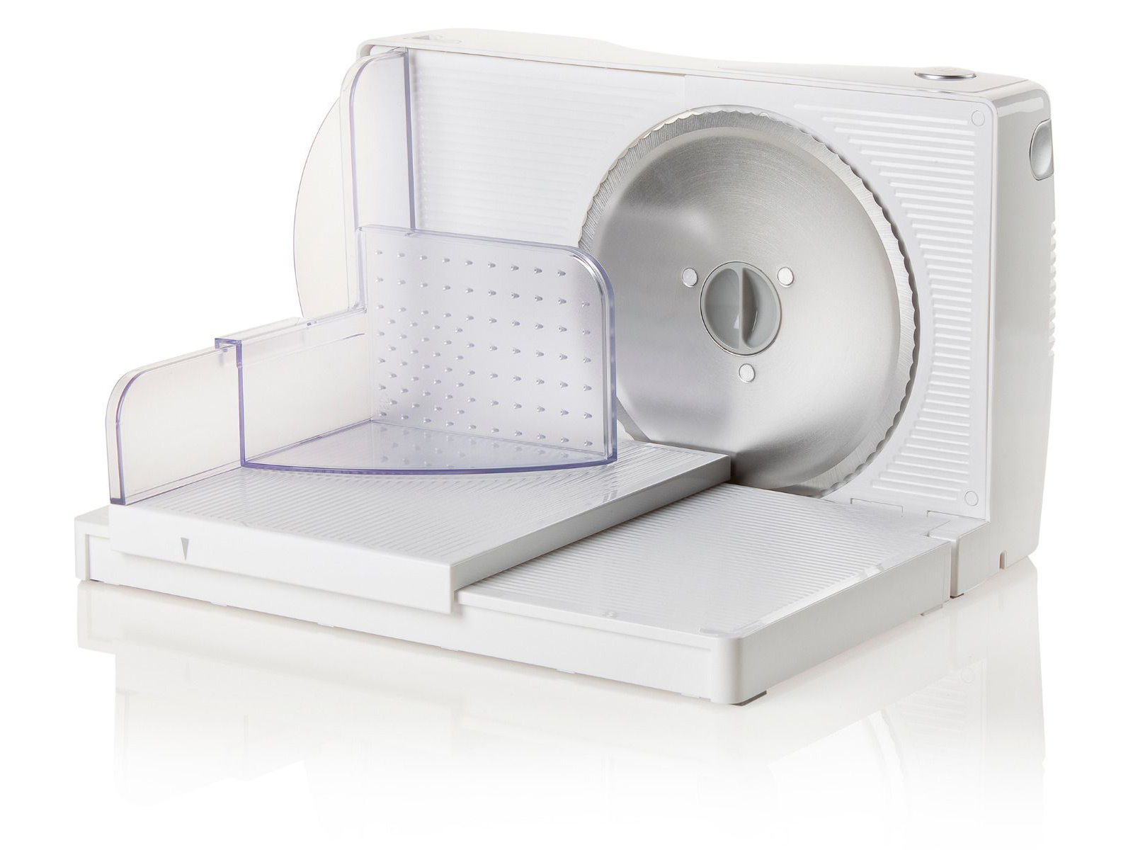 Biała krajalnica do żywności z okrągłym ostrzem, ustawiona pod kątem, na białej powierzchni.