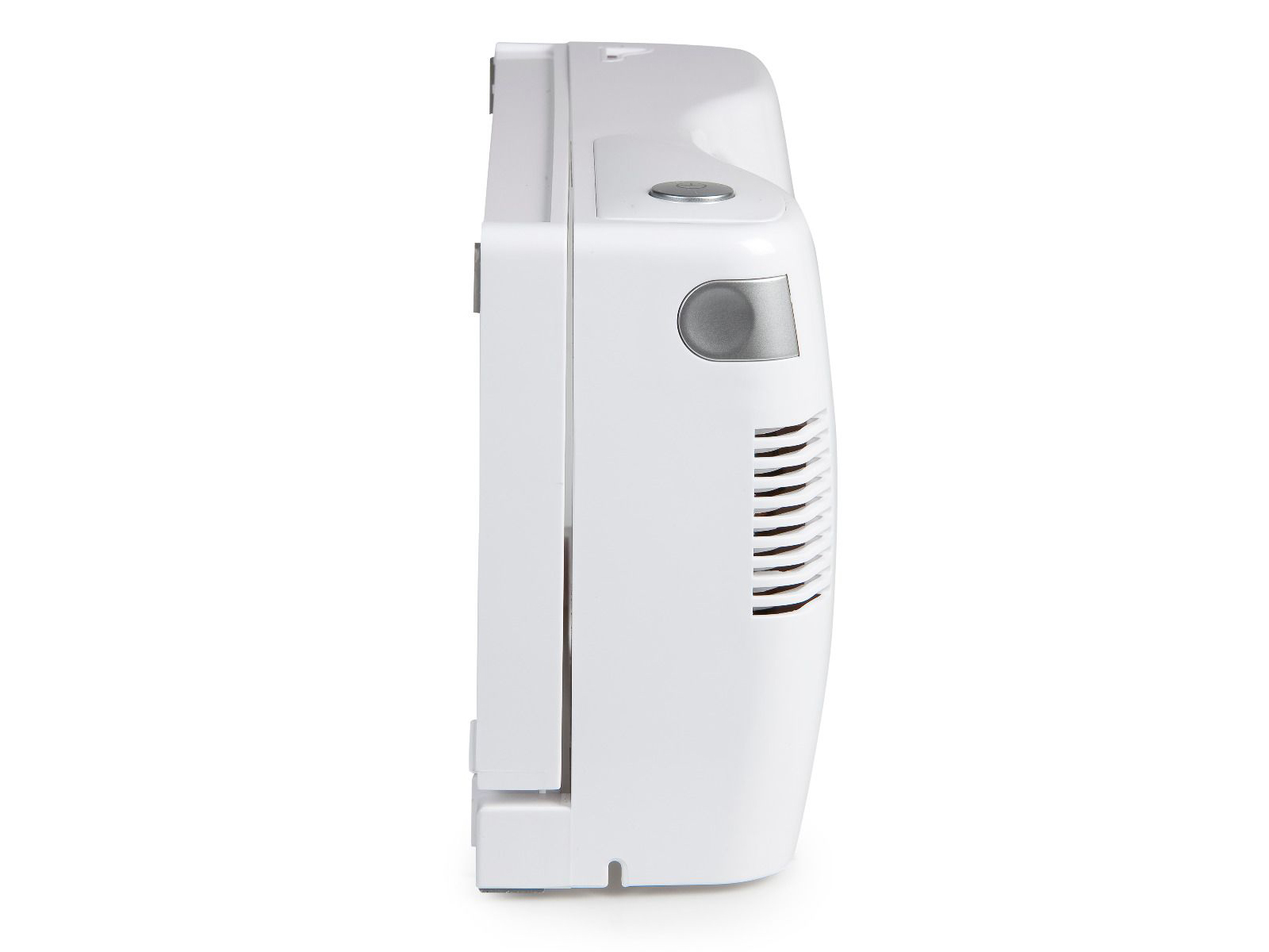 Białe urządzenie medyczne z kratką wentylacyjną z boku, na białym tle.