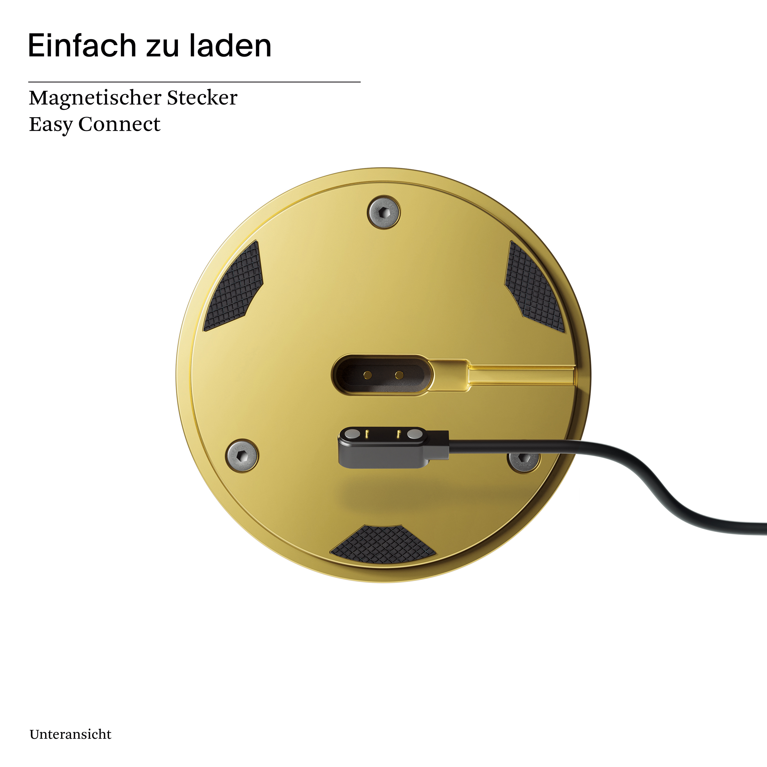 Unterseite eines goldfarbenen Geräts. Es hat schwarze Gummi-Griffe und einen magnetischen Ladeanschluss.