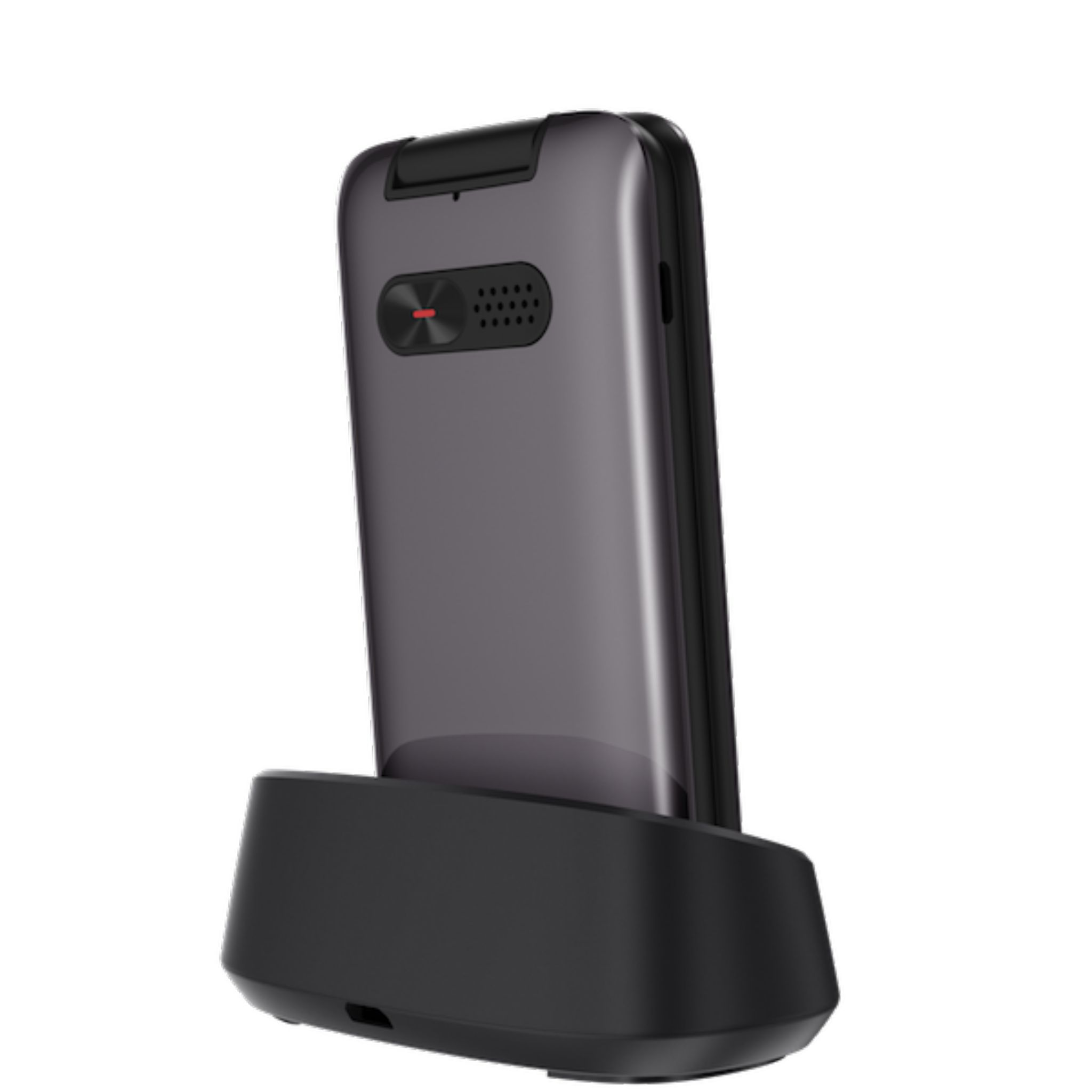 Zamknięty, szary telefon z klapką w czarnej stacji ładującej. Telefon jest pod kątem.