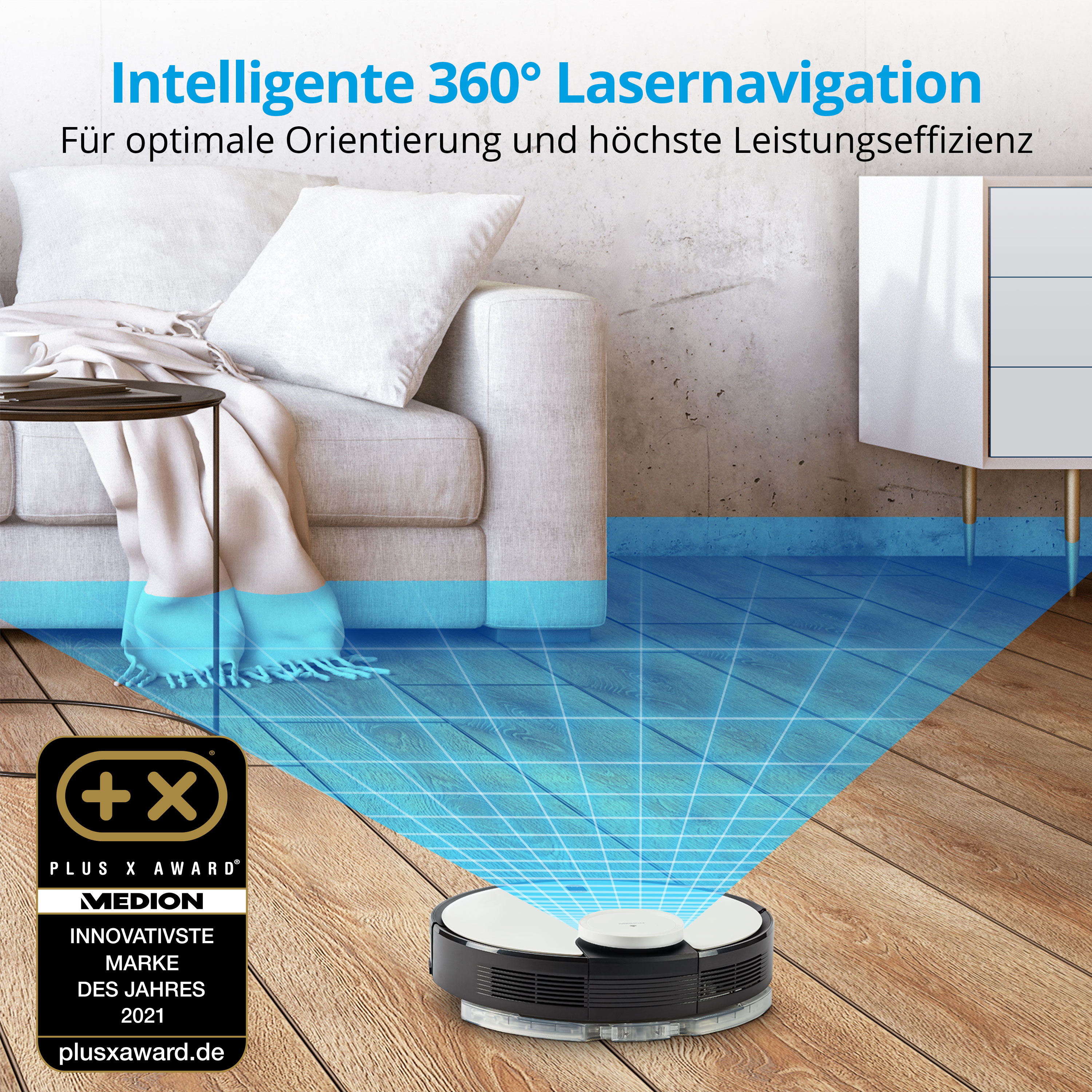 Robot sprzątający na drewnianej podłodze, z kanapą w tle.