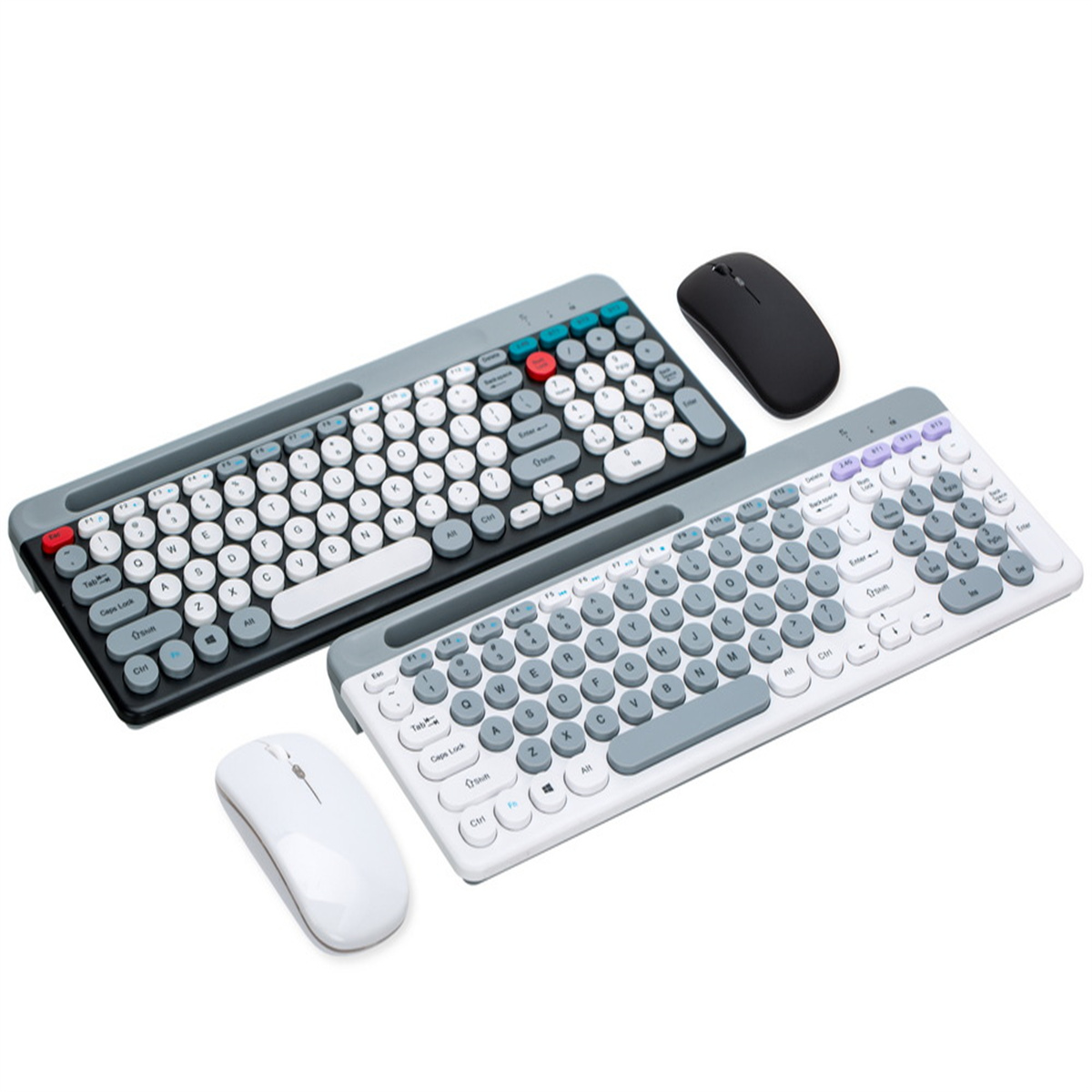 Dos teclados y ratones. Un juego es gris y blanco, y el otro negro y gris. Fondo blanco.