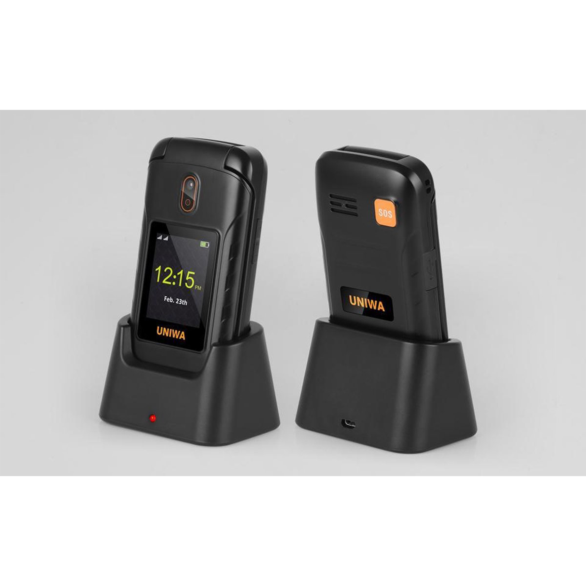 Dwa czarne telefony z klapką na podstawkach ładujących. Lewy telefon jest włączony i pokazuje godzinę.