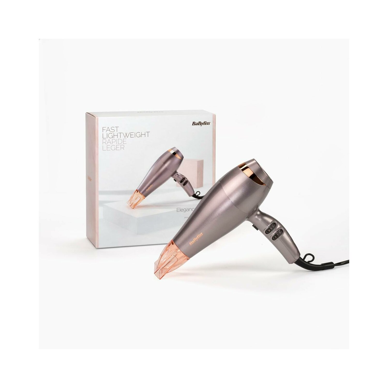 Suszarka do włosów i jej pudełko. Suszarka jest szara z różowo-złotymi akcentami.