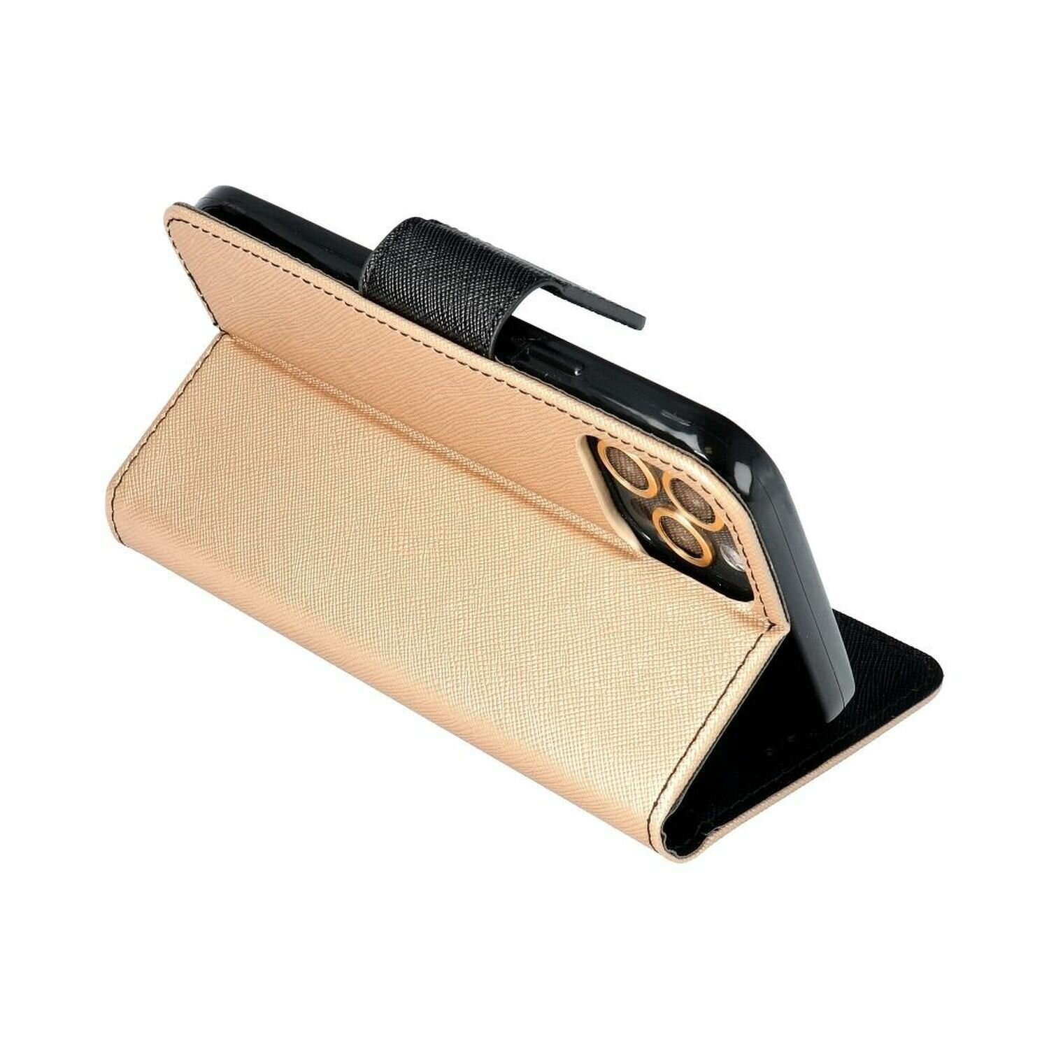 Ein Telefonetui, das zur Seite geöffnet ist und ein Telefon abstützt. Das Etui ist goldfarben, mit schwarzem Halter.