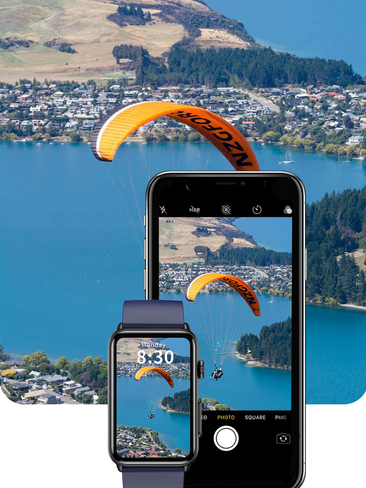 Smartwatch und Telefon zeigen Landschaft mit Gleitschirmfliegern über Wasser und Stadt.