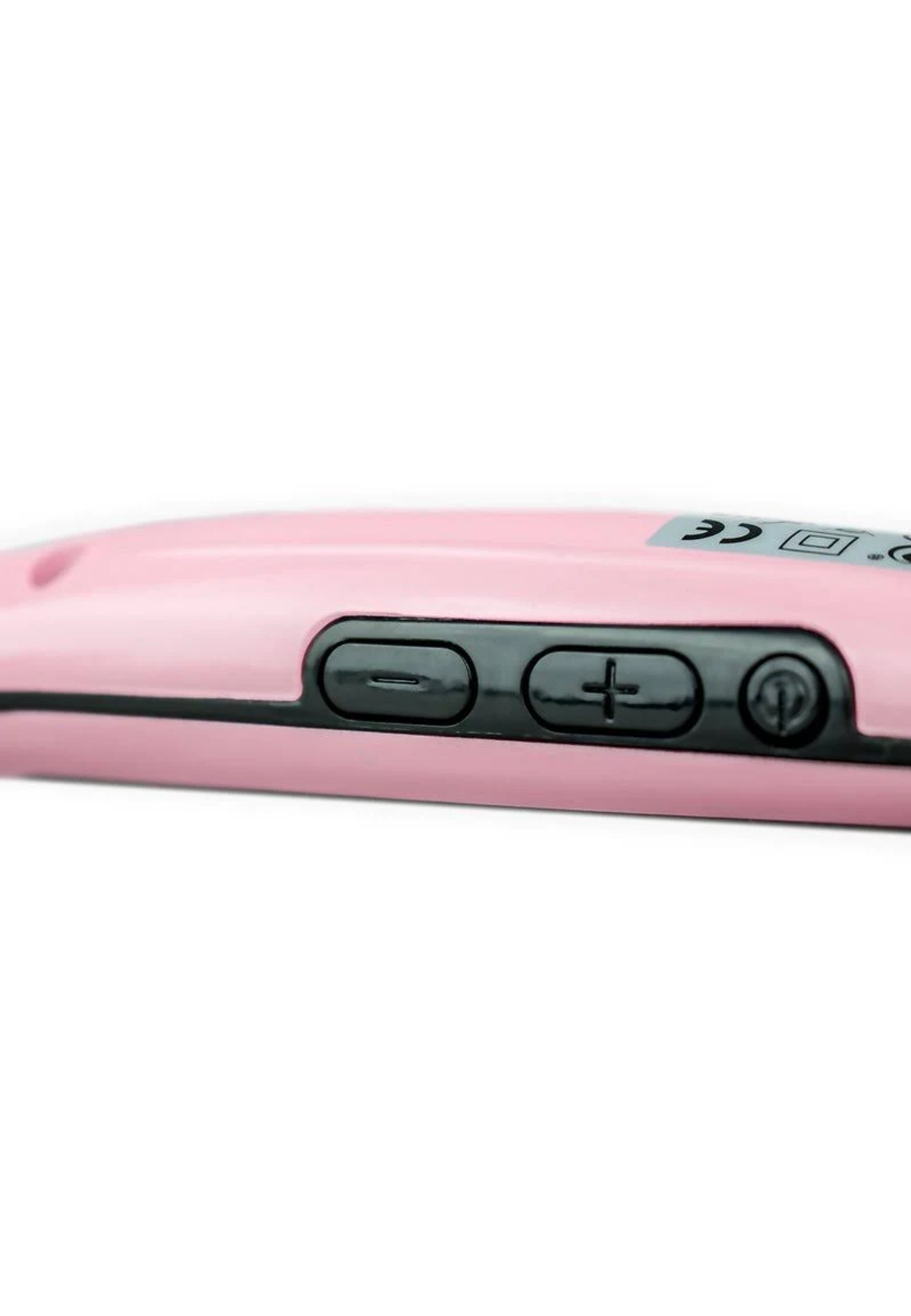 Zbliżenie różowej lokówki z czarnymi przyciskami. Tło jest białe.