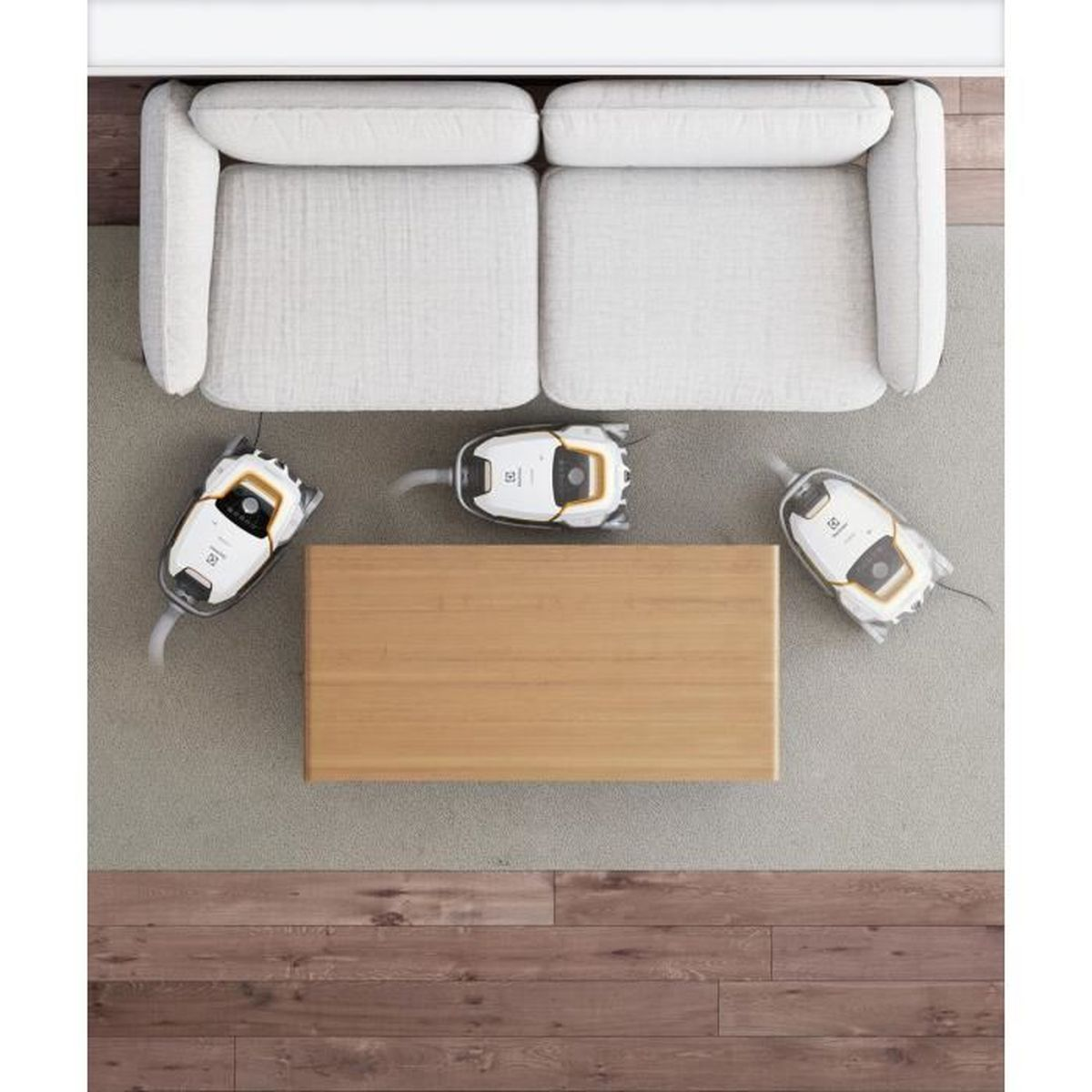 Widok z góry na salon z sofą, stolikiem kawowym i trzema robotami sprzątającymi.