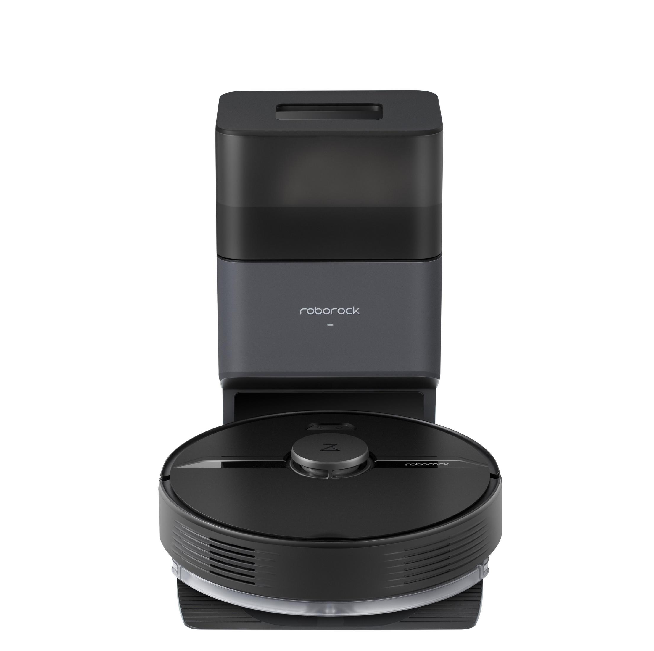 Czarny robot sprzątający Roborock i stacja ładująca. Na białym tle.